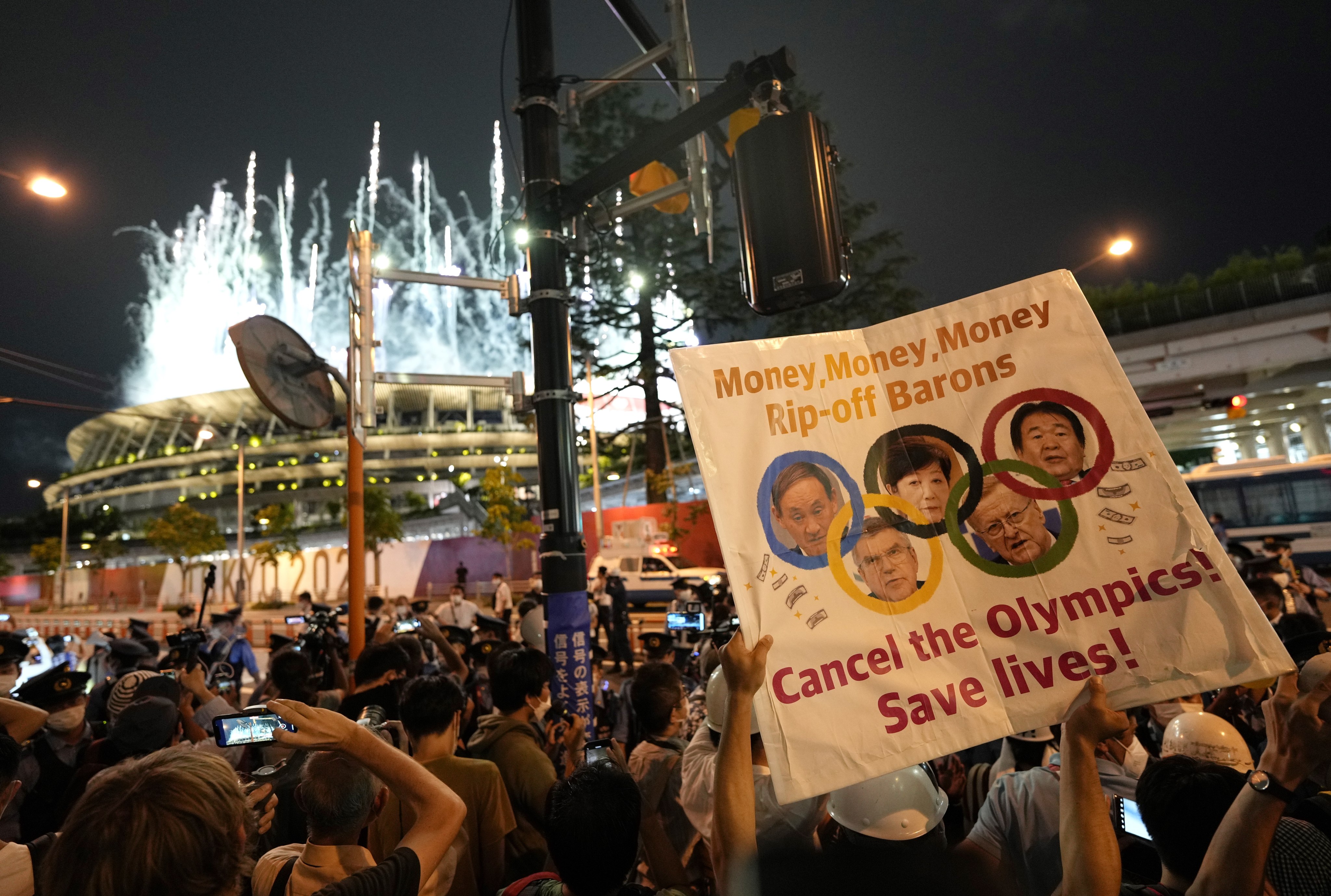 Demonstrators staged a protest against the Tokyo 2020 Olympic Games outside the National Stadium during the opening ceremony. Photo: EPA-EFE