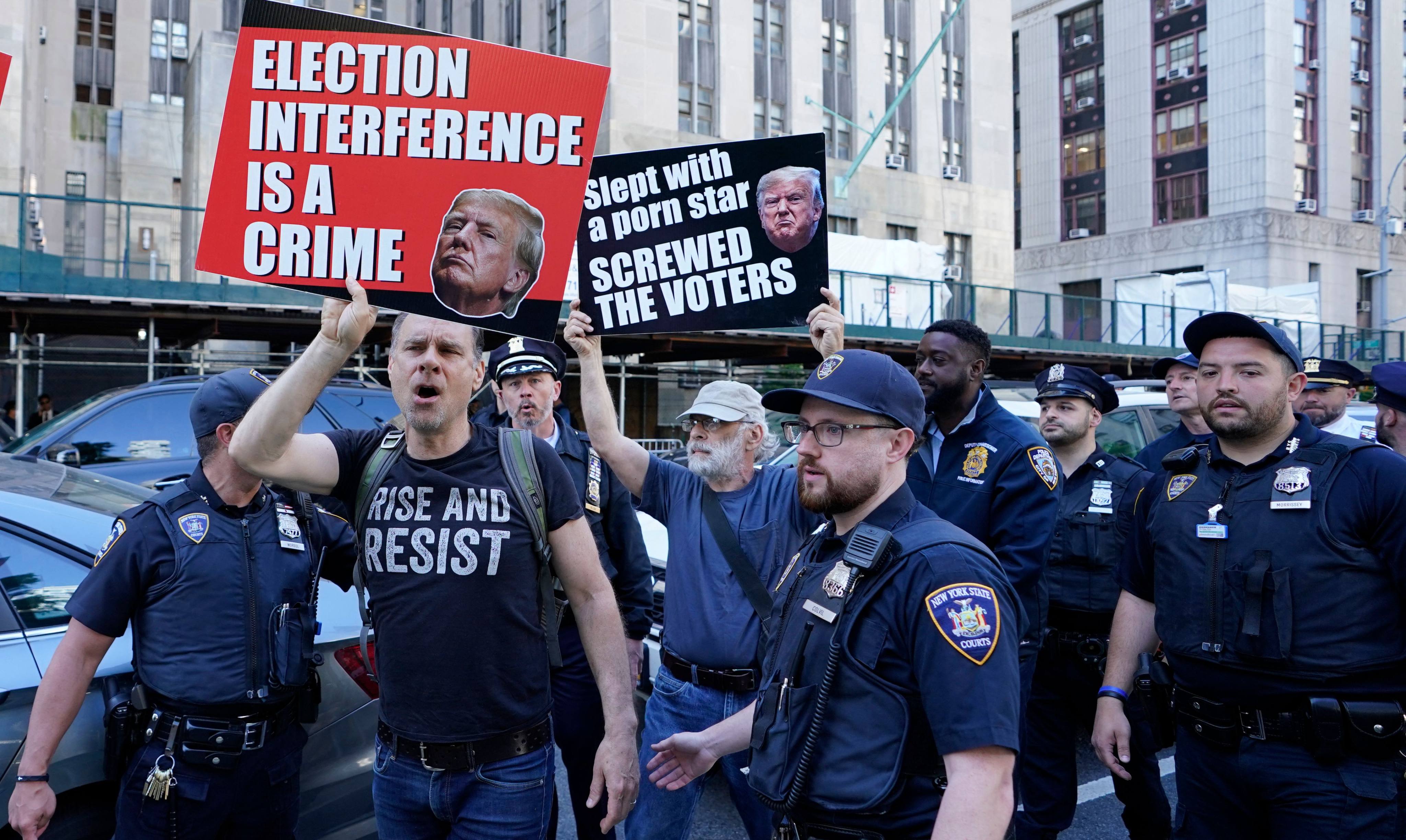 Anti-Trump protesters outside Manhattan Criminal Court in New York on Monday. Photo: AFP