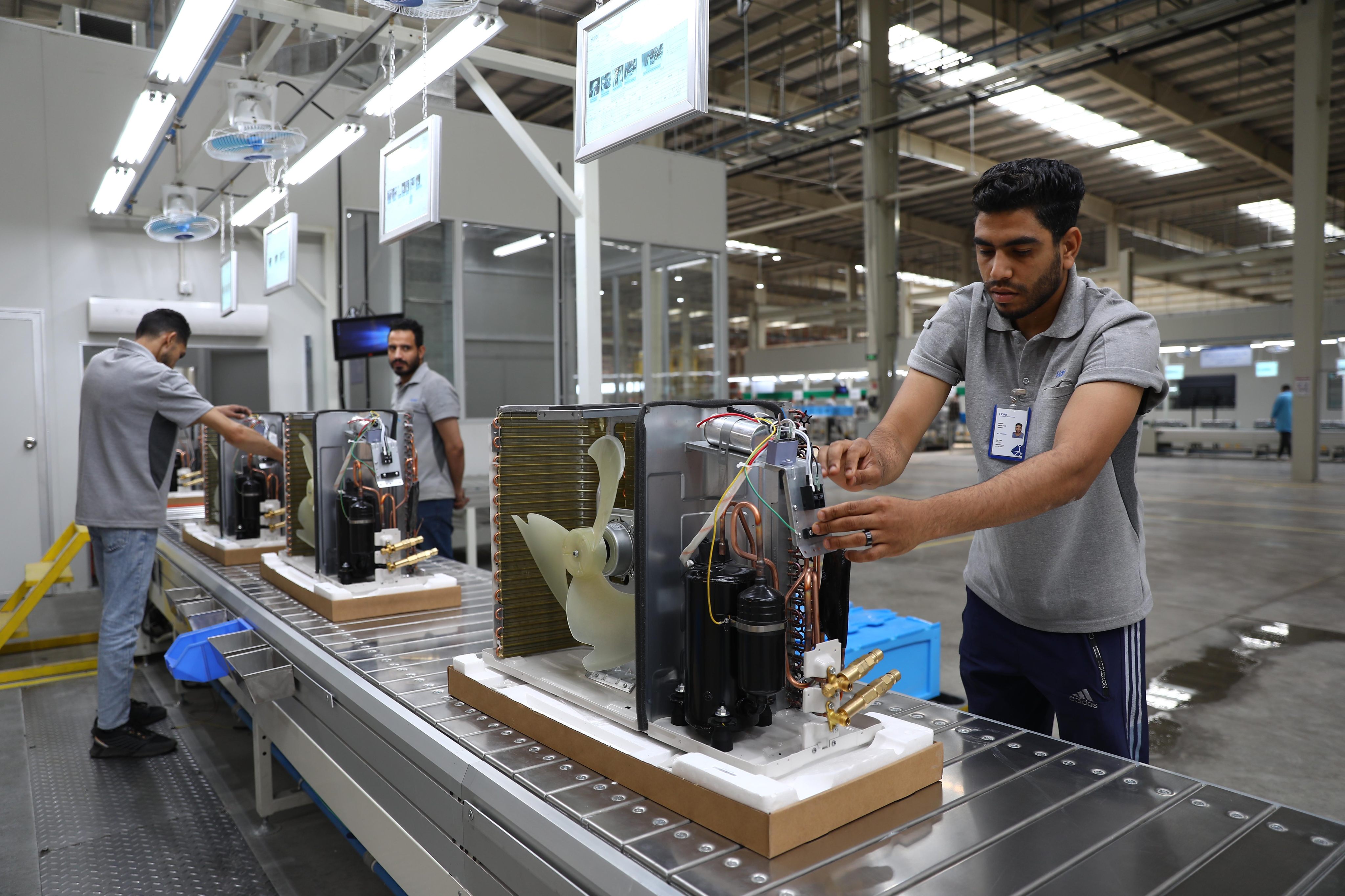Workers assemble air conditioners on a production line at a factory of the Haier Egypt Ecological Park in 10th of Ramadan City, Egypt, on May 1. The industrial park is one of many recent examples of China’s increasing investment in Egypt. Photo: Xinhua