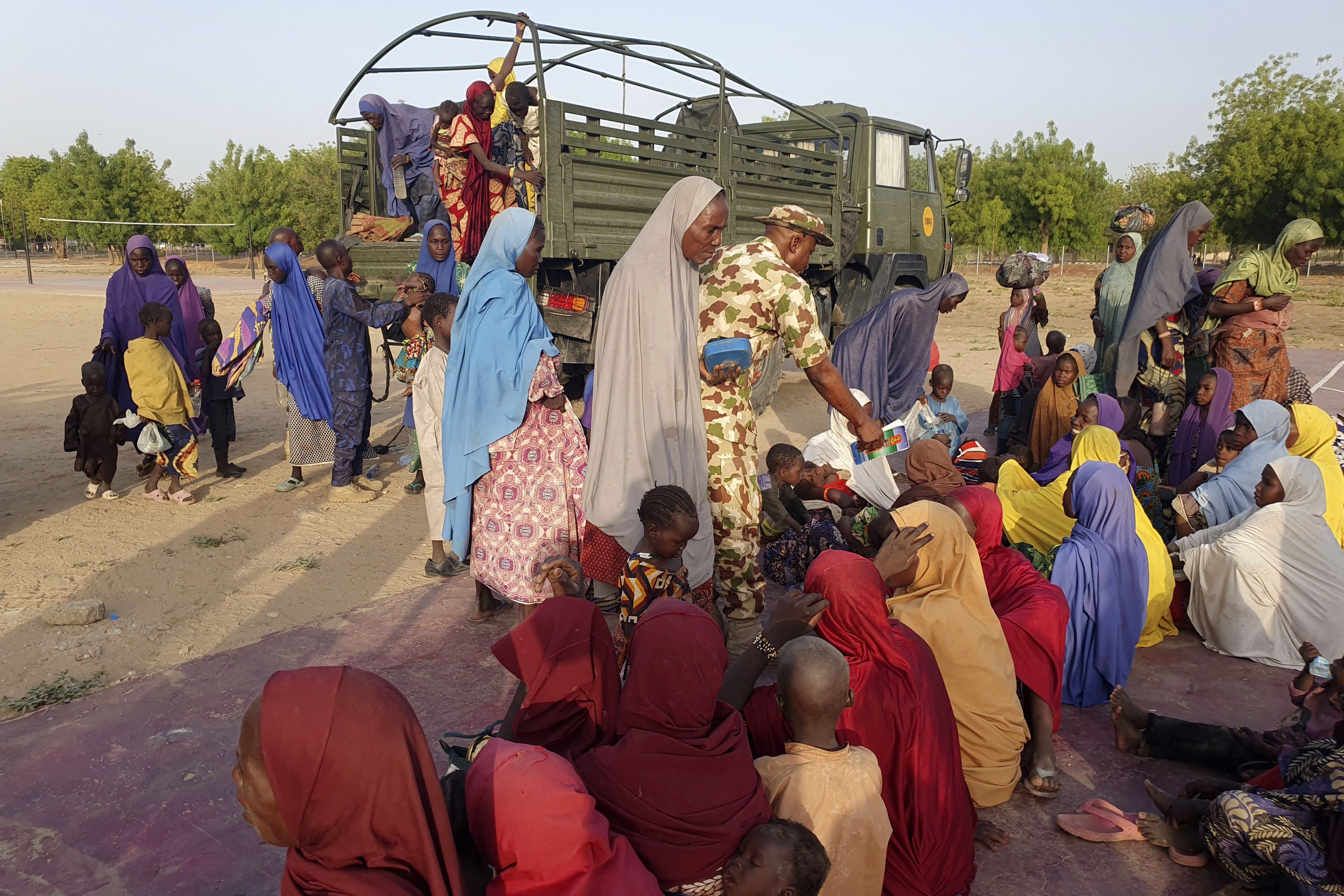 Women and children who were held captive by islamic extremists, and rescued by Nigeria’s army, arrive in Maiduguri on Monday. Photo: AP