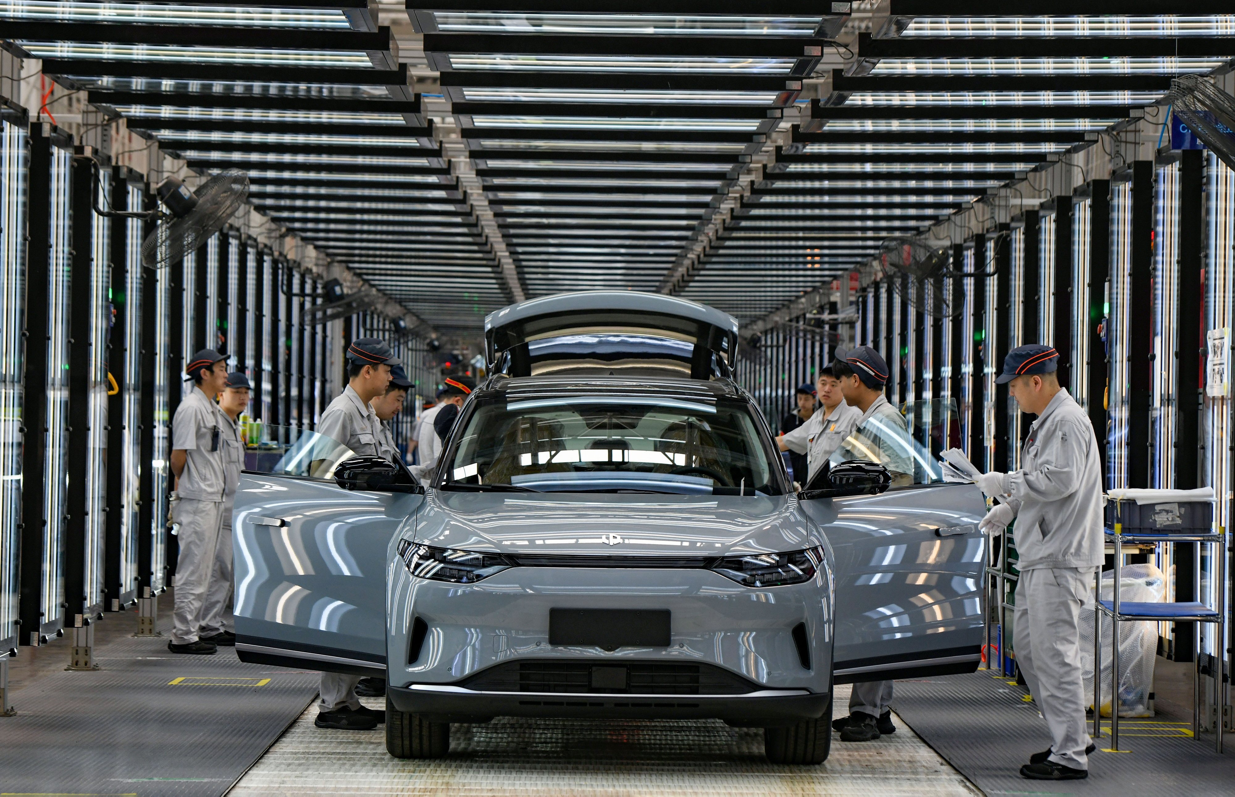 Employees work on the assembly line of new energy vehicles at a factory of Chinese EV startup Leapmotor on April 1 in Jinhua in China’s Zhejiang province. The Biden administration has announced an increase in tariffs on Chinese electric vehicle imports to 100 per cent. Photo: VCG/ Getty Images