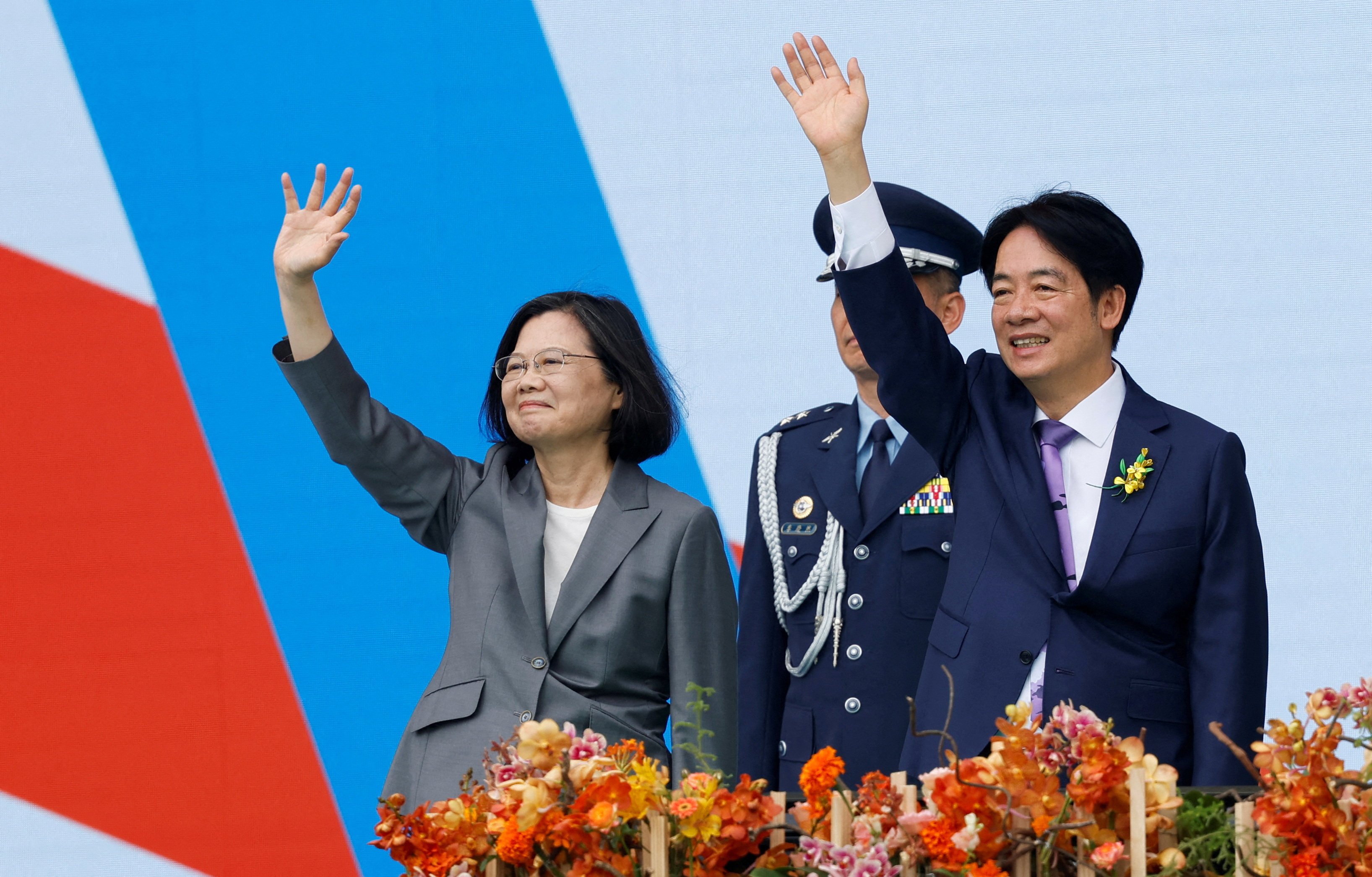 New Taiwanese leader William Lai Ching-te (right) waves with his predecessor Tsai Ing-wen (left) after his inauguration in Taipei on May 20, 2024. Photo: Reuters
