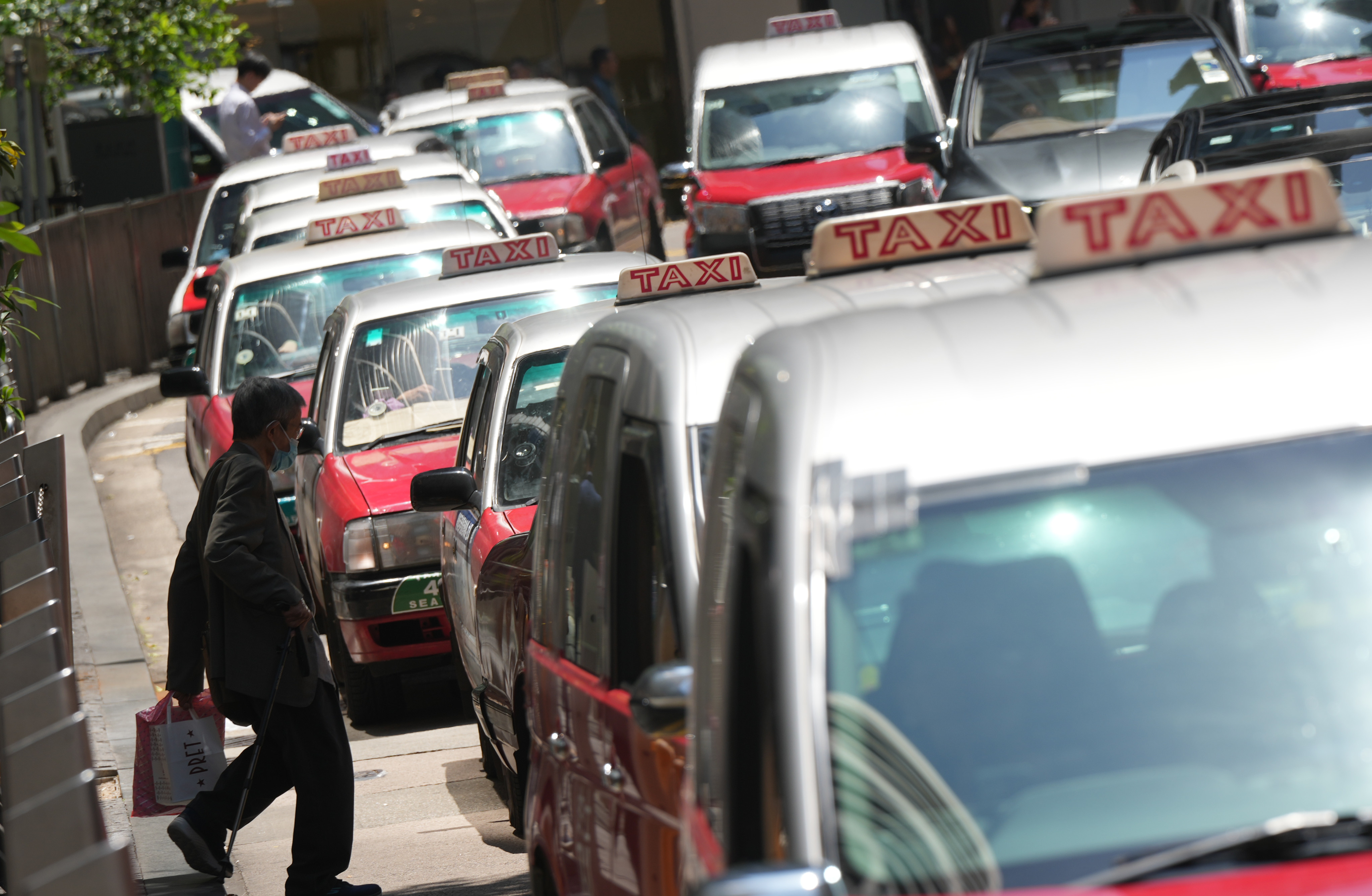 Taxis in Hong Kong’s Central district. Ride-hailing rivals such as Uber operate in a legal grey area, undeterred by relatively few prosecutions of drivers. Photo: May Tse