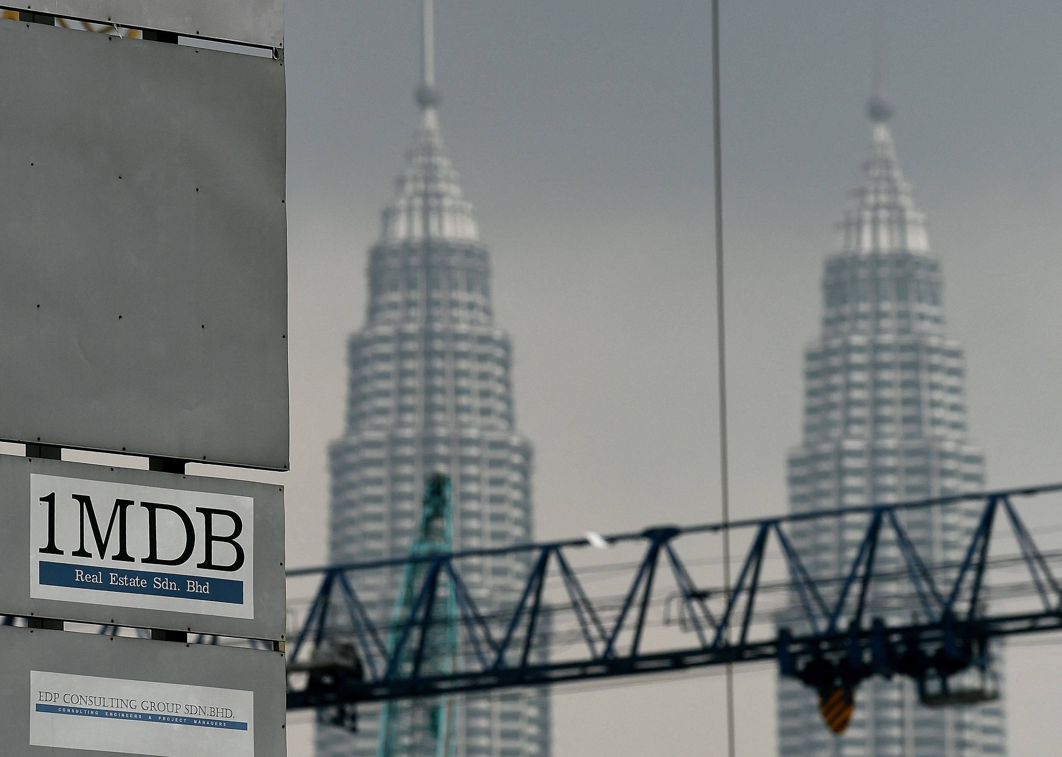 The 1MDB logo is seen on a billboard at the fund’s flagship Tun Razak Exchange under-development site in Kuala Lumpur. Photo: AFP