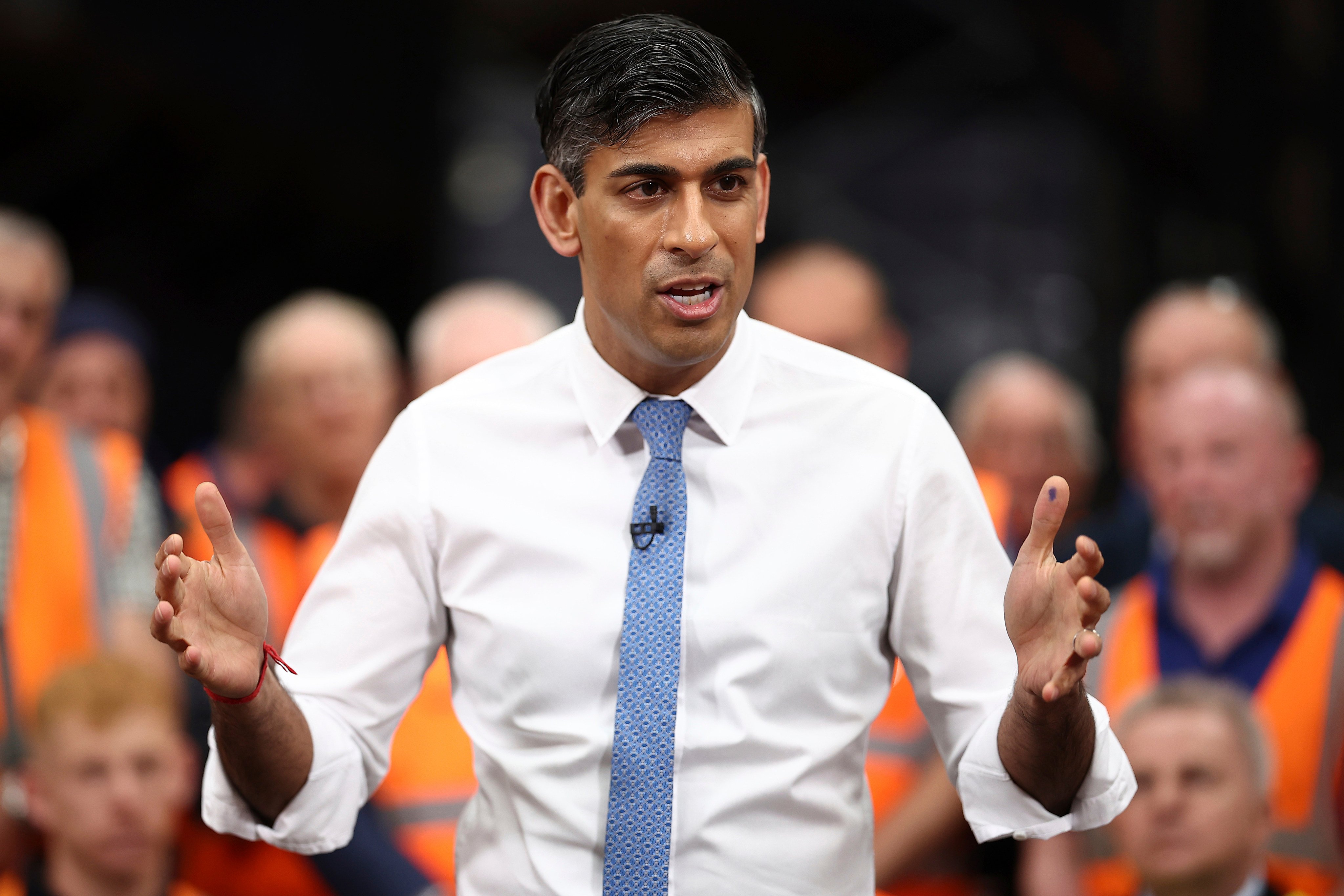 Britain’s Prime Minister and Conservative Party leader Rishi Sunak holds a Q&A with staff at a distribution centre in Britain on Thursday. Photo: Pool/AP