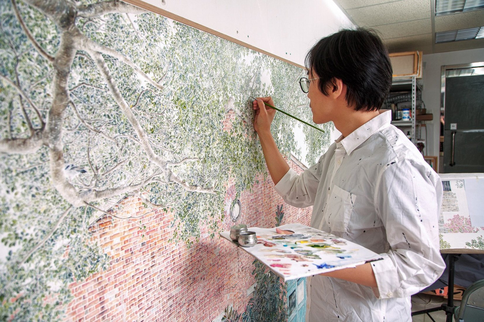Hong Kong artist Fung Chim at work. He is one of five Hong Kong artists whose paintings feature in the exhibition Mandala at Sansiao Gallery in the city’s Central district and which are characterised by their repetitive patterns. 