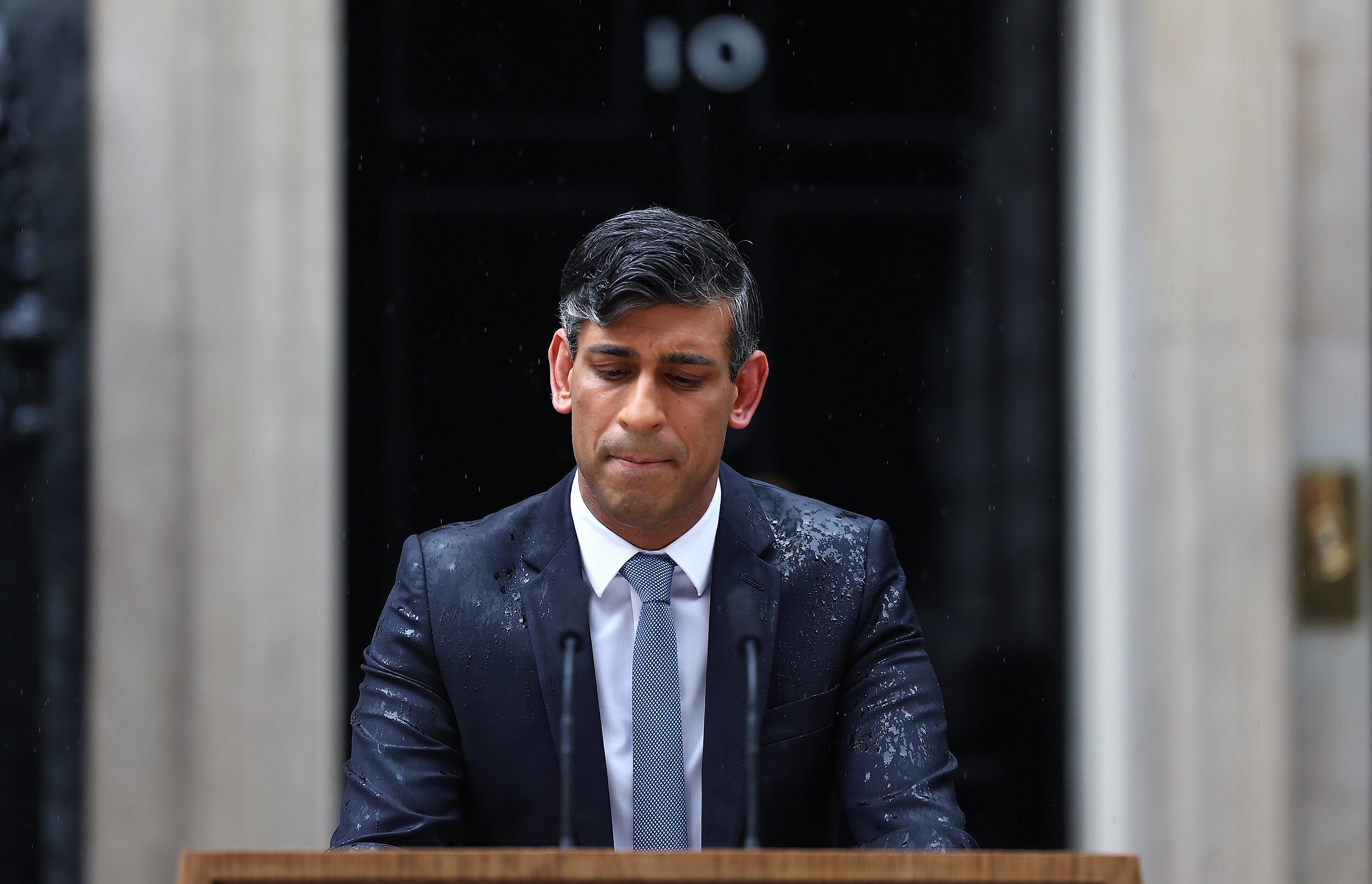 The private reaction of many Conservative MPs was bemusement at Prime Minister Rishi Sunak’s election announcement in pouring rain outside 10 Downing Street on May 22, a picture that has drawn unfavourable commentary and cheeky headlines. Photo: TNS 
