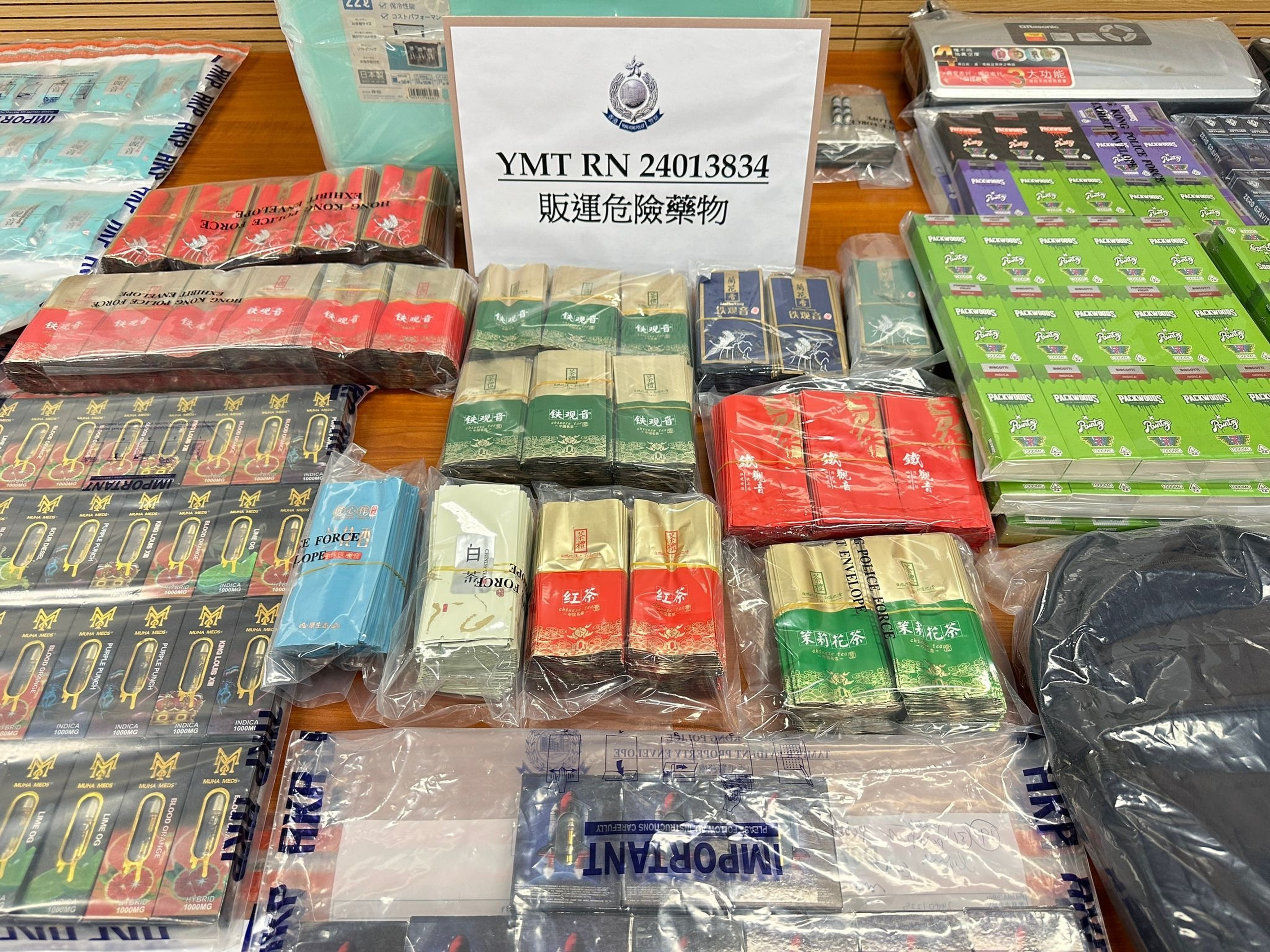 Police display items seized in a raid on a flat in Yau Ma Tei. Photo: Handout