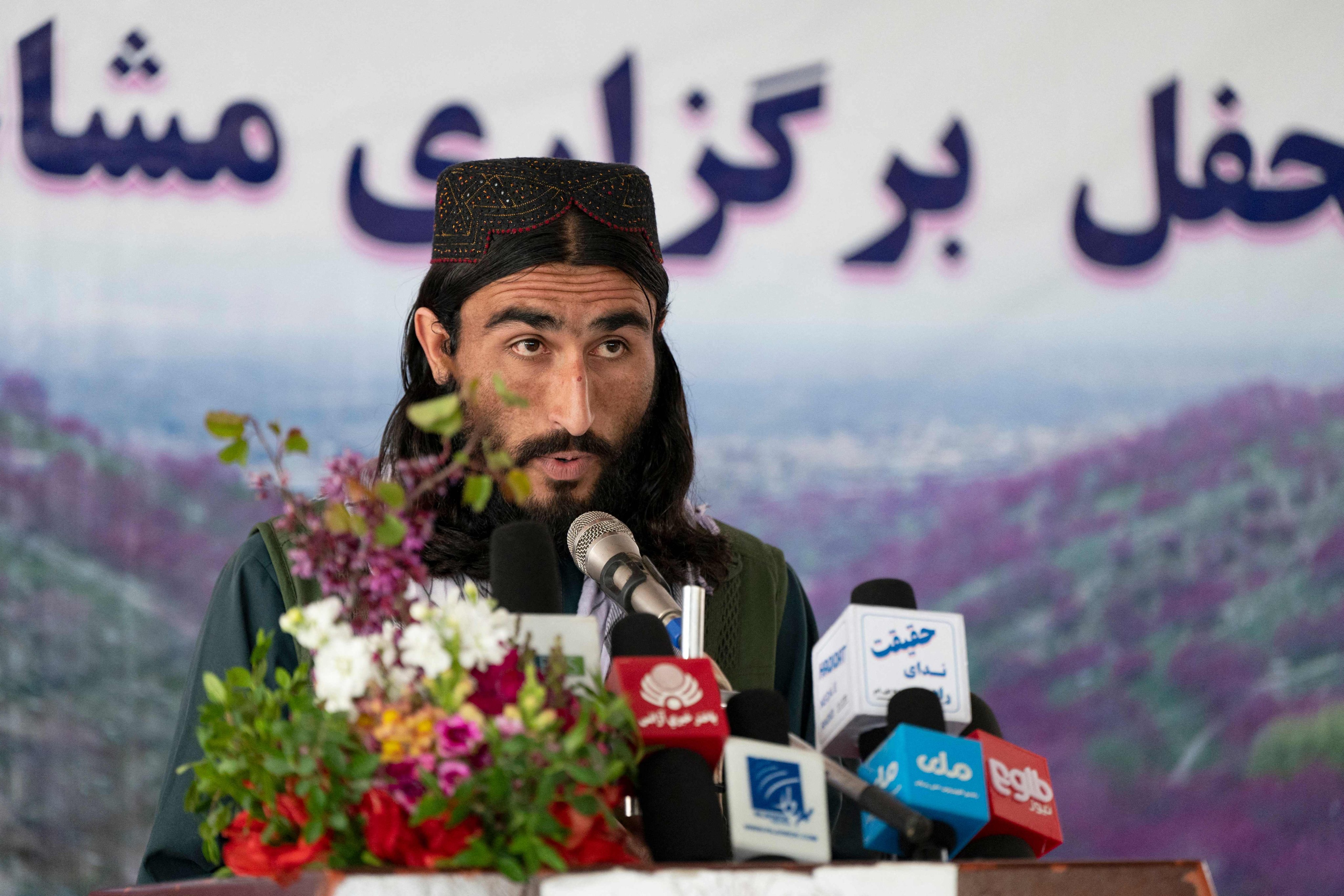 Samiullah Hamas recites poetry at the Purple Flower Poetry Festival, in Charikar district, Parwan Province, Afghanistan. The event featured a male-only line-up reading pro-Taliban verses to a male-only audience. Women poets, like other women, have been silenced. Photo: AFP