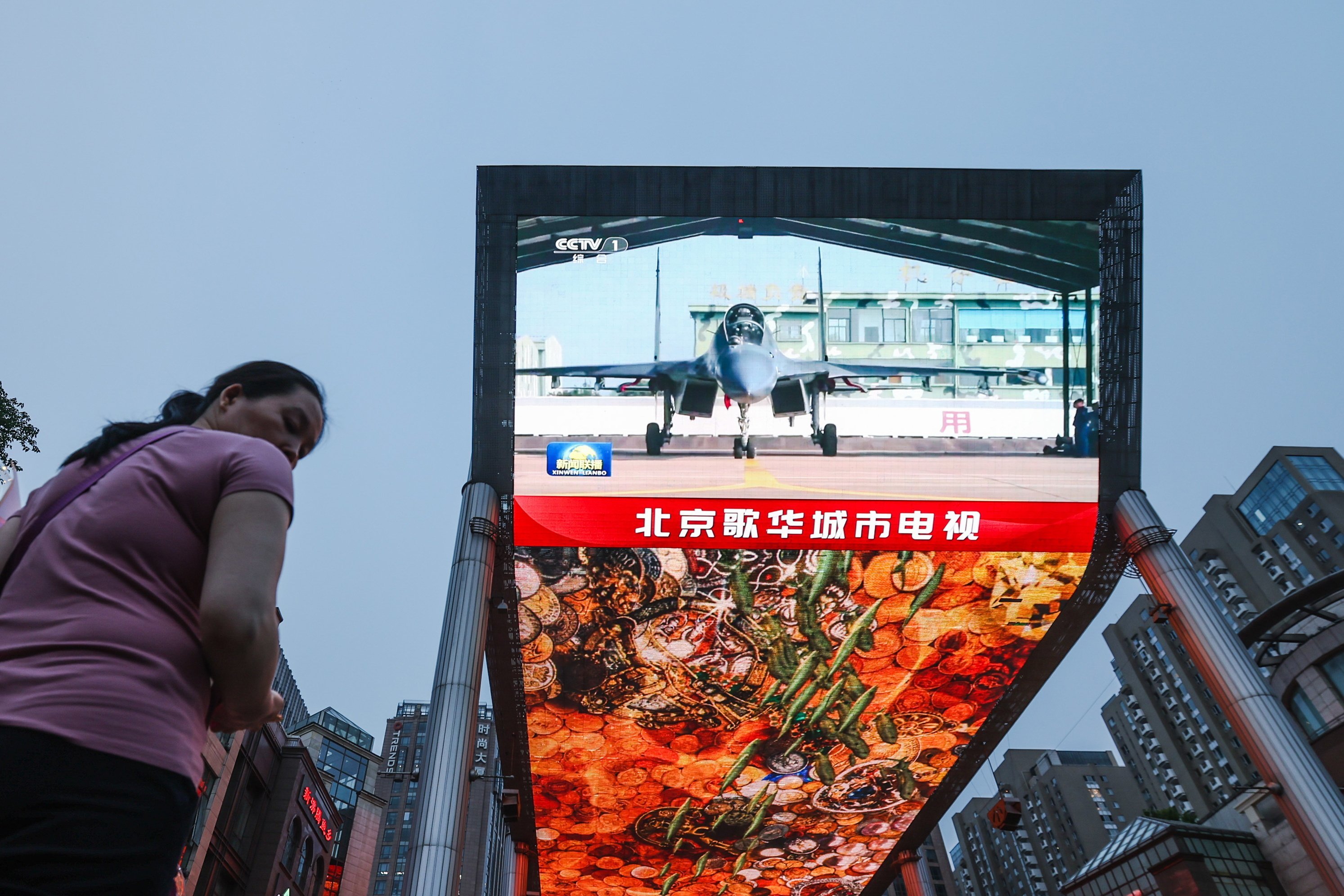 A large outdoor television screen in Beijing broadcasts news of mainland China’s military drills conducted around Taiwan on Thursday. Photo: EPA-EFE