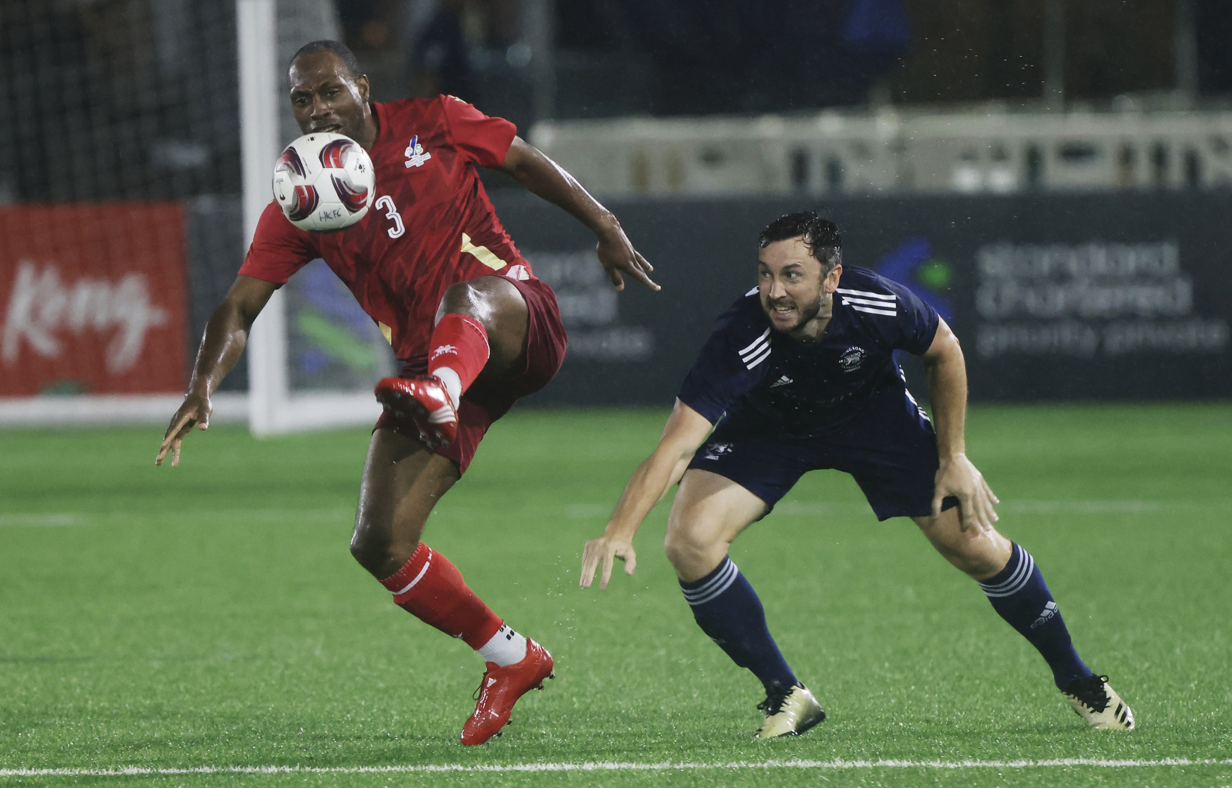 PFA All Stars’ Kyel Reid shields the ball from Shane Jeffery of HKFC Chairman’s Select at the Soccer Sevens. Photo: Jonathan Wong