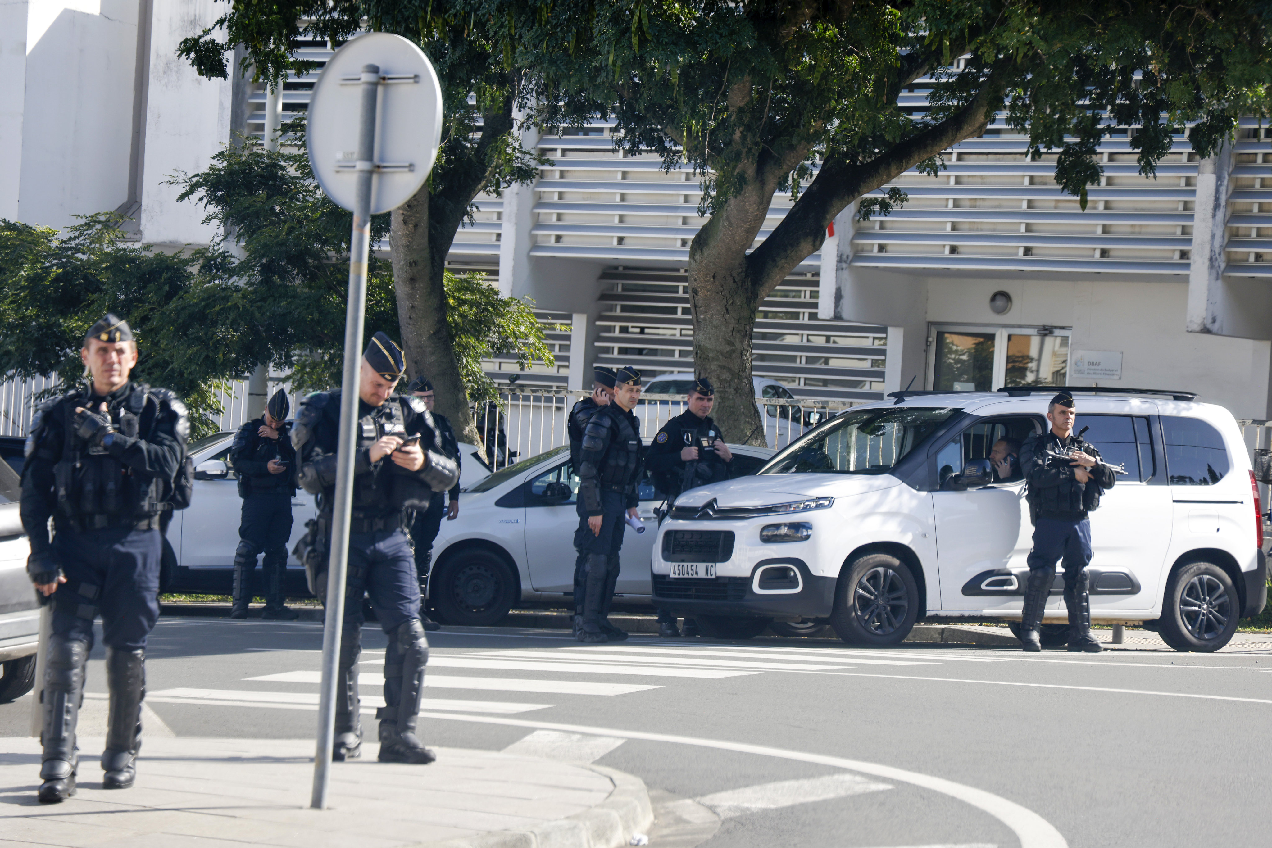 Security forces stand guard outside the French High Commissioner’s office as French President Emmanuel Macron meets with New Caledonia’s elected officials in Noumea, New Caledonia on Thursday. Photo: Pool/AP