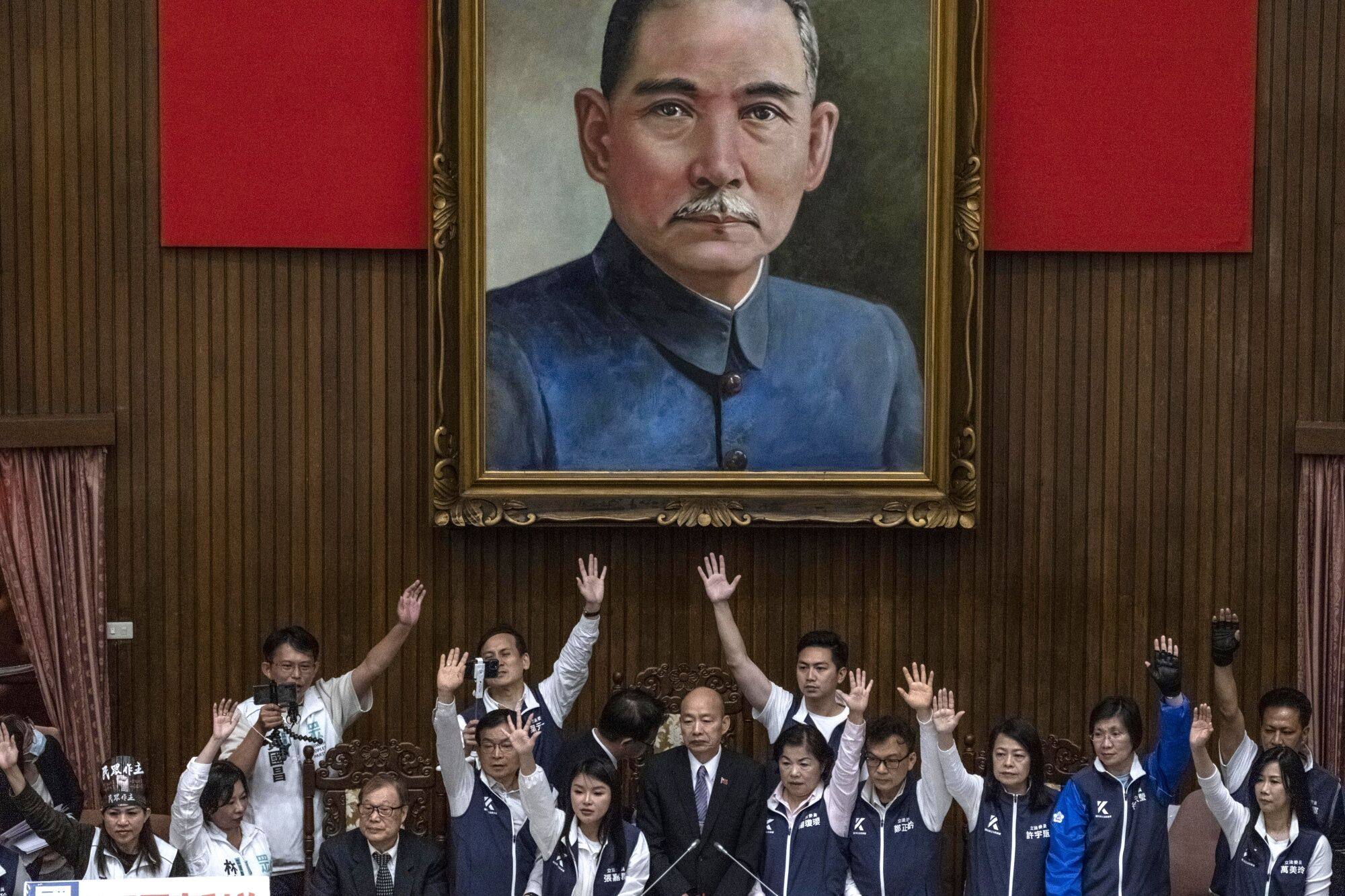 KMT lawmakers gather around the speaker during a protest by their DPP counterparts in the Taiwanese legislature on Tuesday, the day after William Lai’s inauguration. Photo: Bloomberg