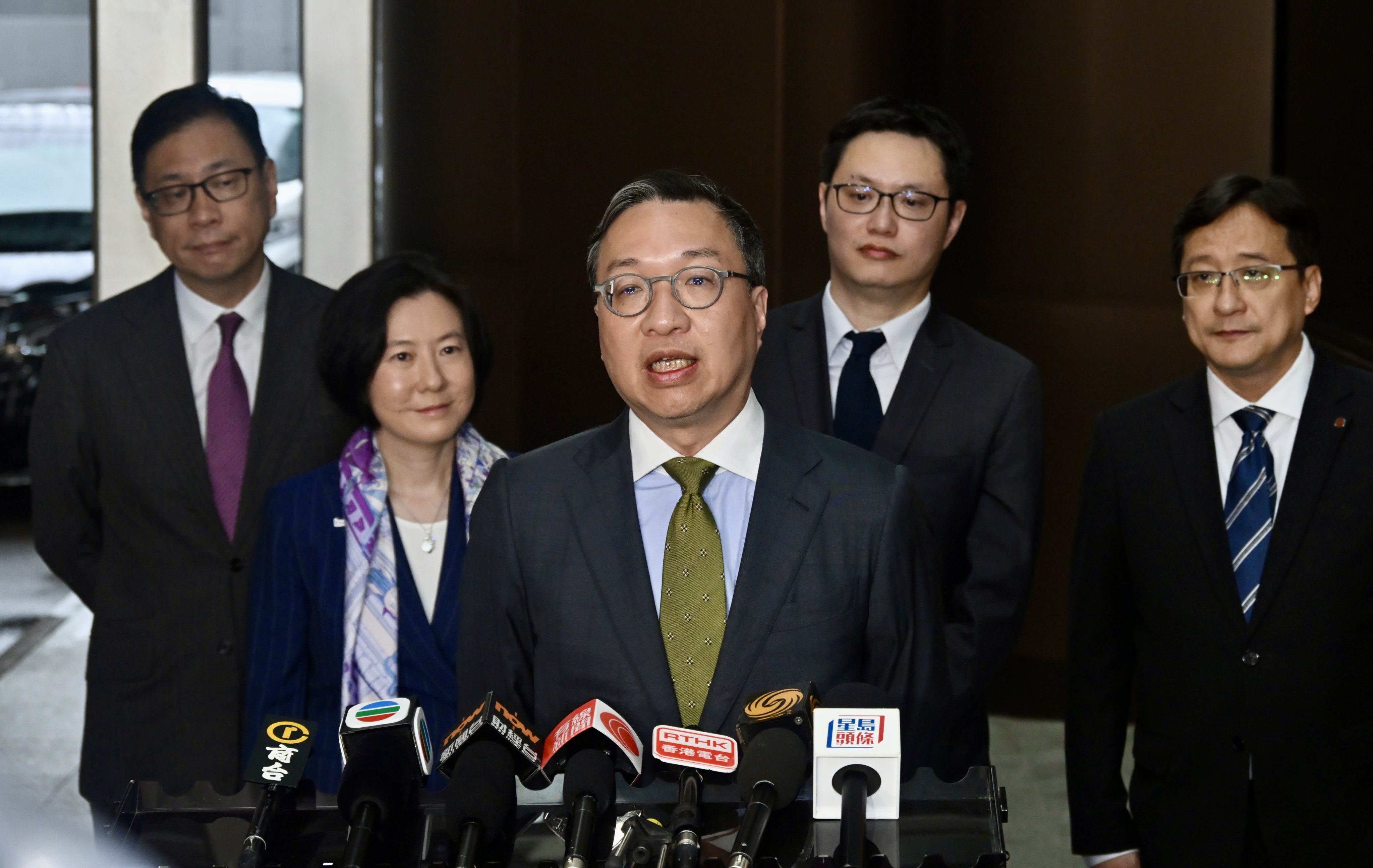 Justice minister Paul Lam (centre) says the US threats of sanctions will not affect his work. Photo: Handout