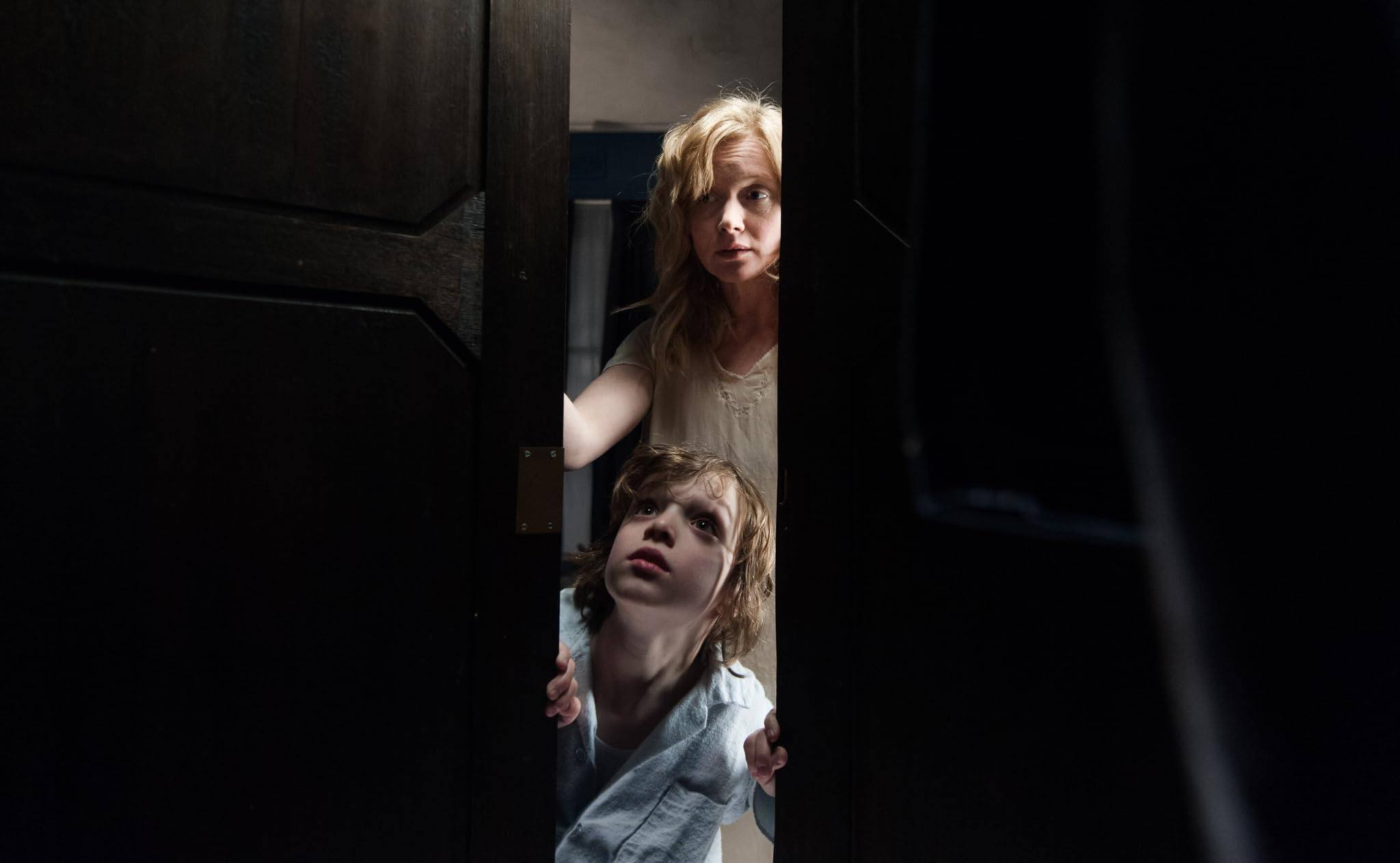 Essie Davis (top) as Amelia and Noah Wiseman as Samuel in a still from The Babadook (2014).

