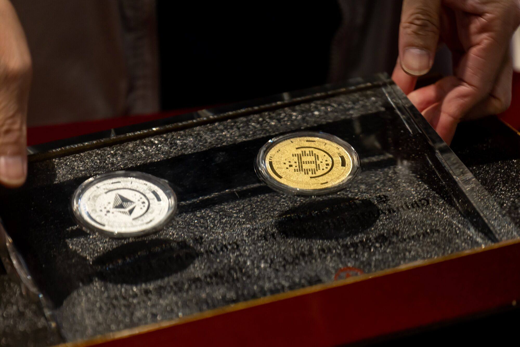 Illustrative bitcoin and ether tokens. Photo: Bloomberg