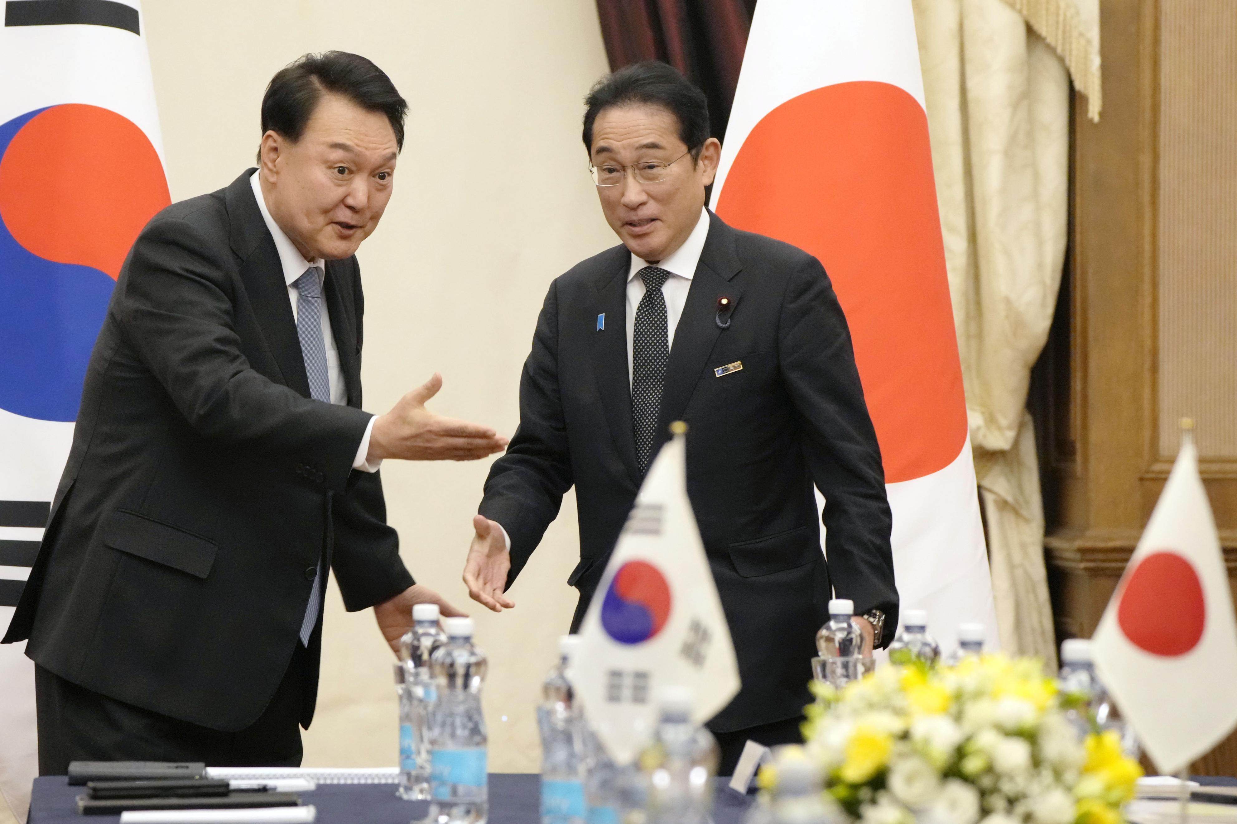 South Korean President Yoon Suk-yeol (left) and Japanese Prime Minister Fumio Kishida have led a marked turnaround in historically strained bilateral ties. Photo:  Kyodo
