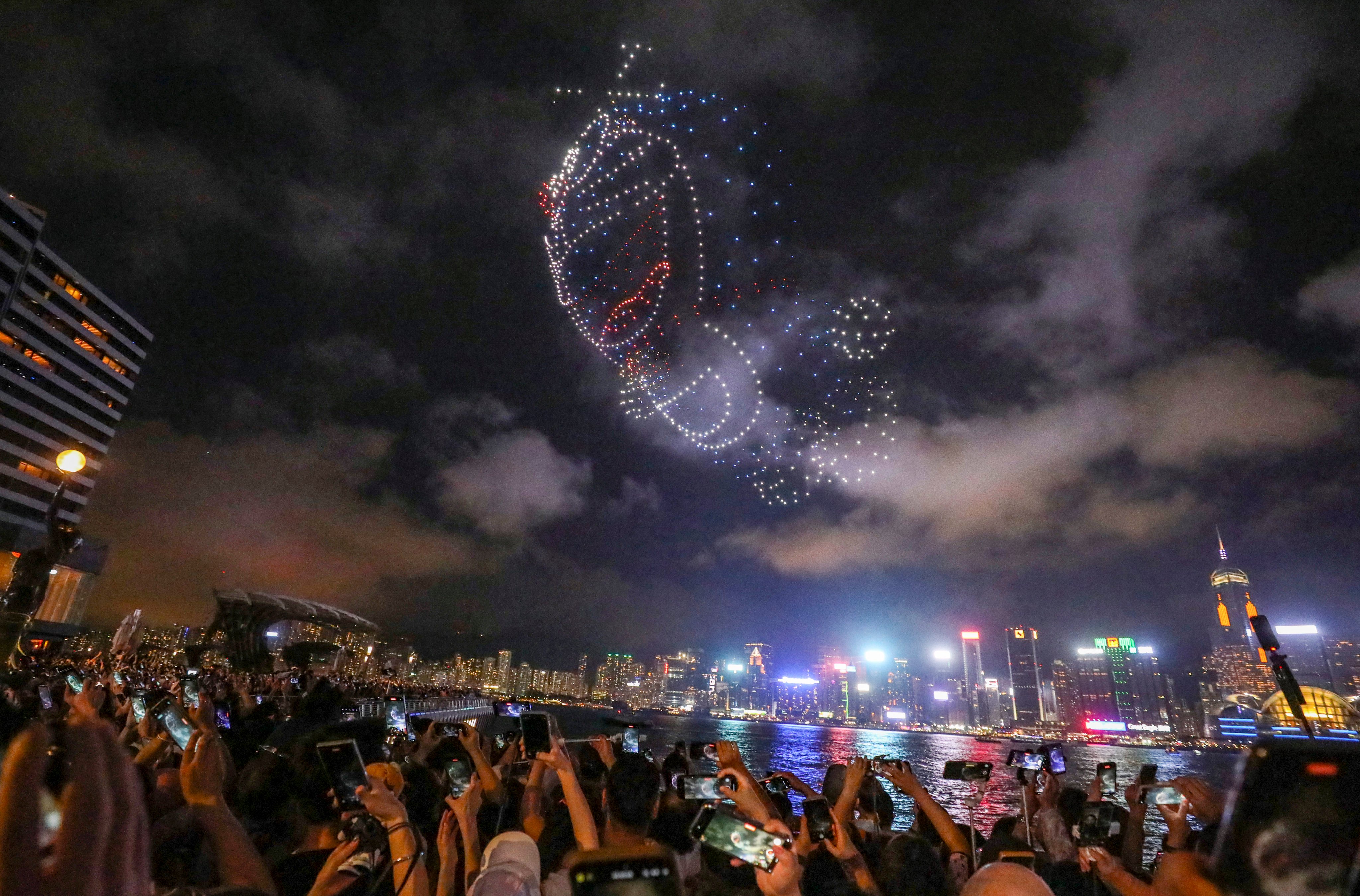 Tsim Sha Tsui Waterfront is packed with people watching a drone performance . Photo: Xiaomei Chen