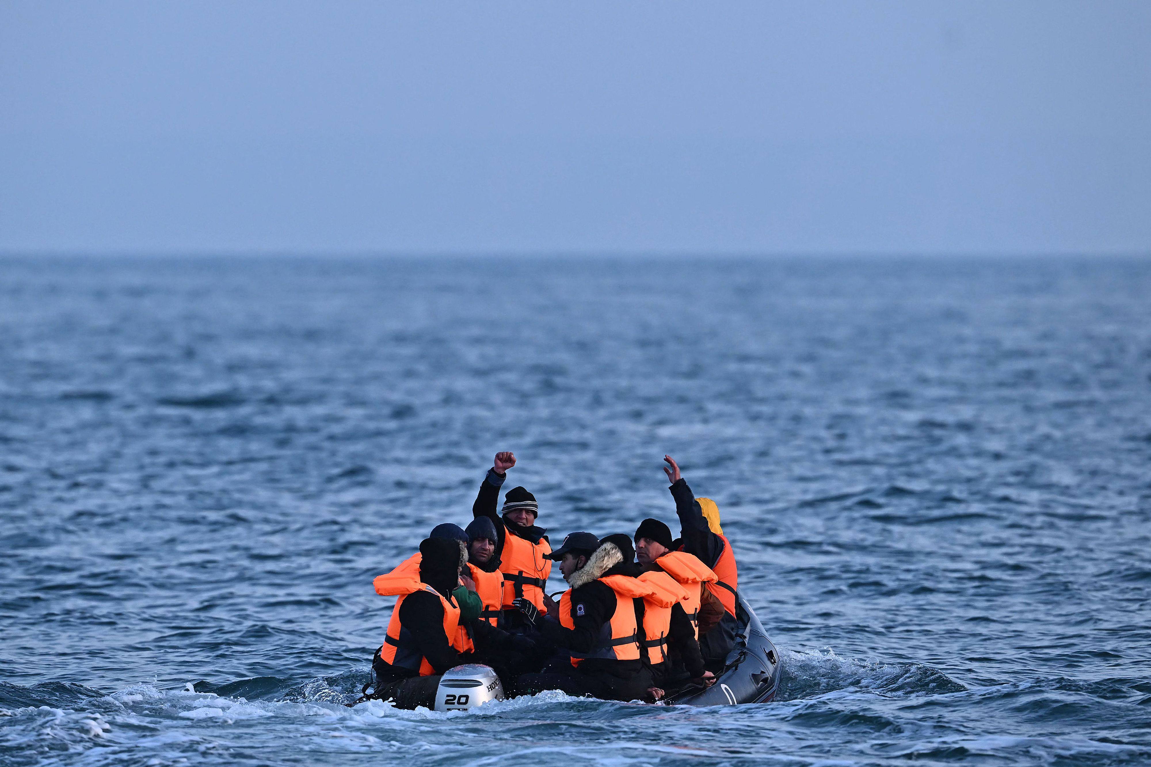 Migrants travel in an inflatable boat across the English Channel, bound for Dover on the south coast of England. Photo: AFP