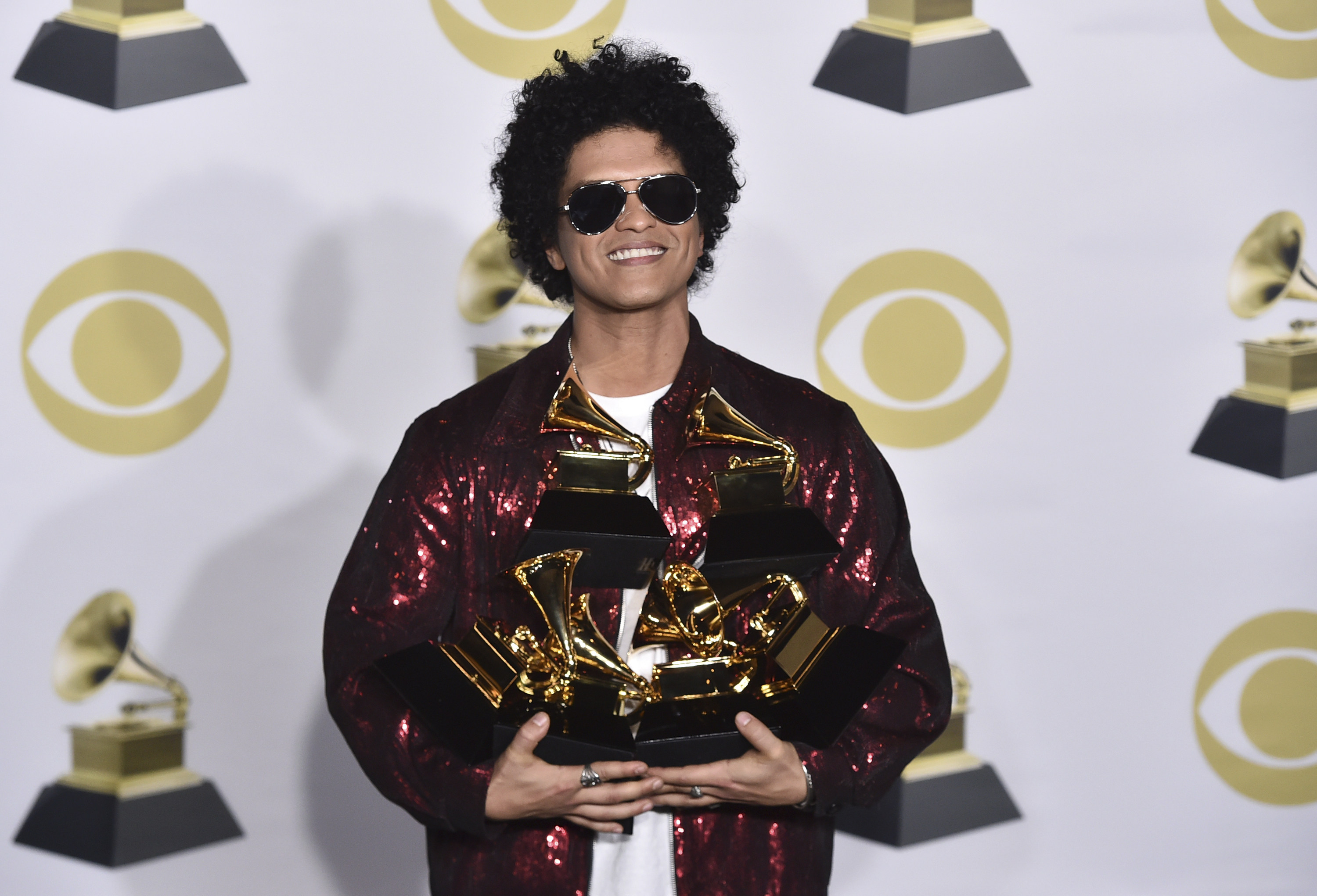 Singer Bruno Mars with his Grammy awards in 2018. Photo: AP