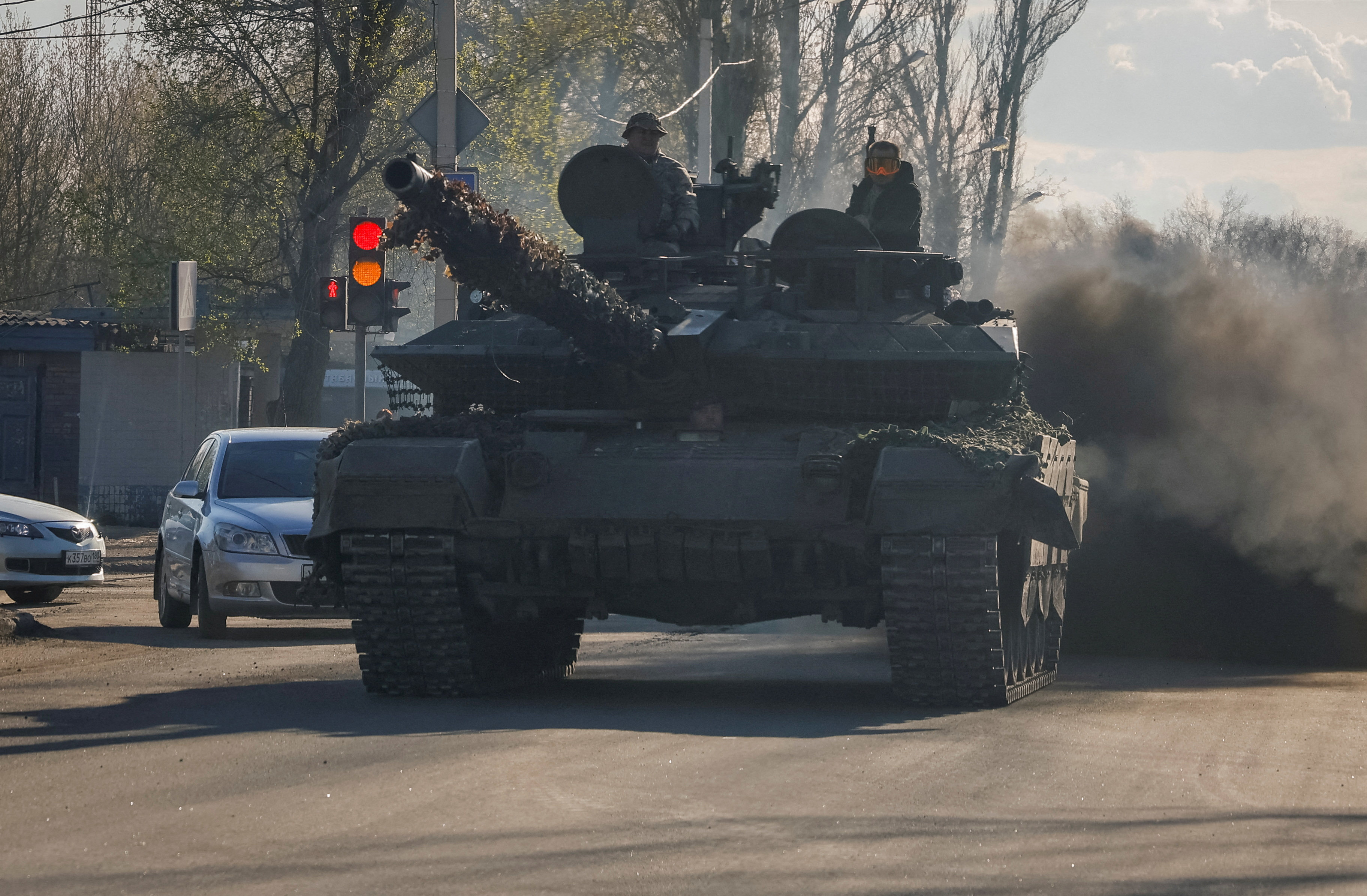 Russian servicemen drive a tank on a street in Donetsk, Russian-controlled Ukraine. Photo: Reuters