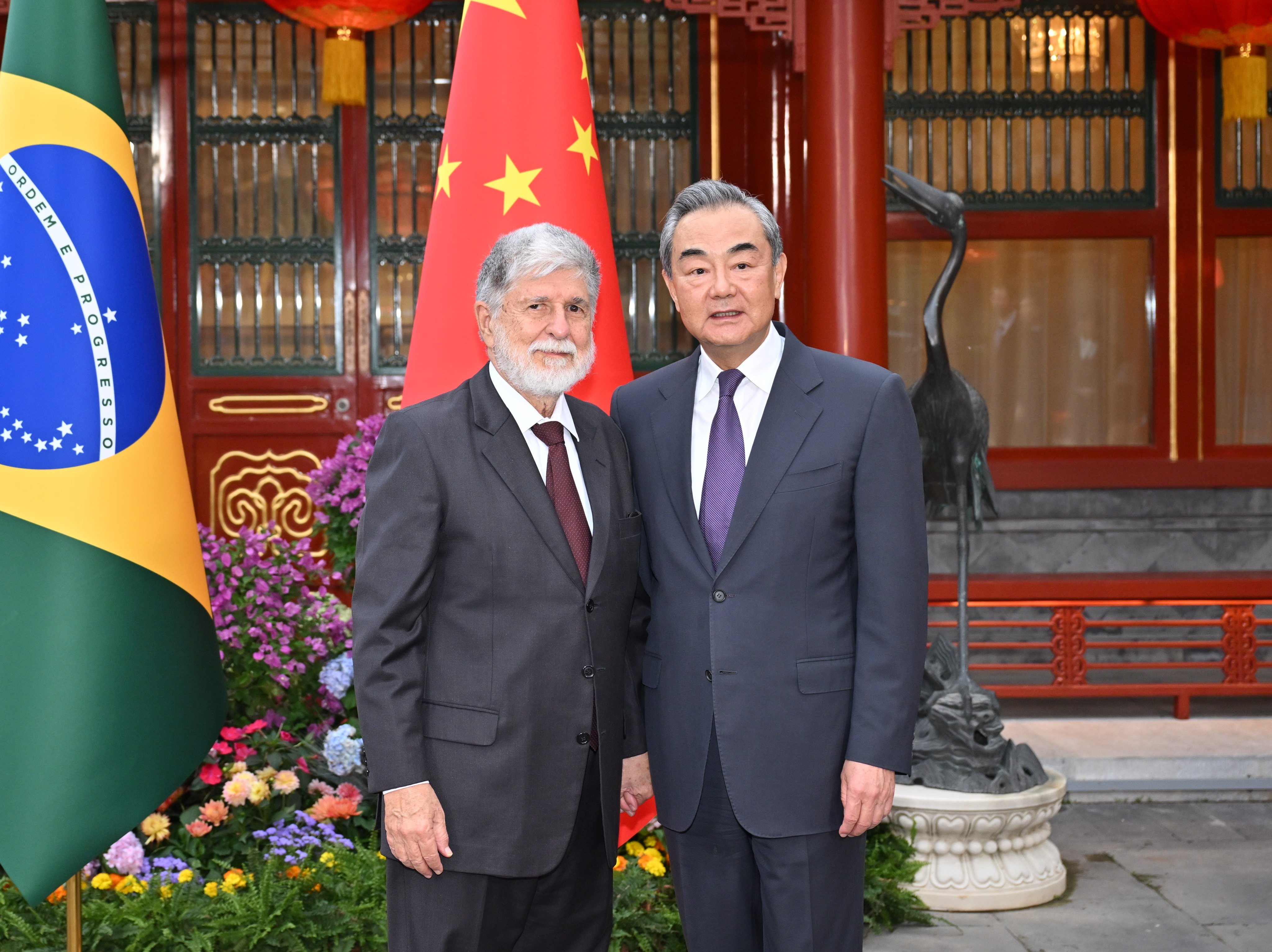 Wang Yi (right), China’s foreign minister, welcomes Celso Amorim, a top adviser to Brazilian President Luiz Inacio Lula da Silva, in Beijing on Thursday. Photo: Xinhua