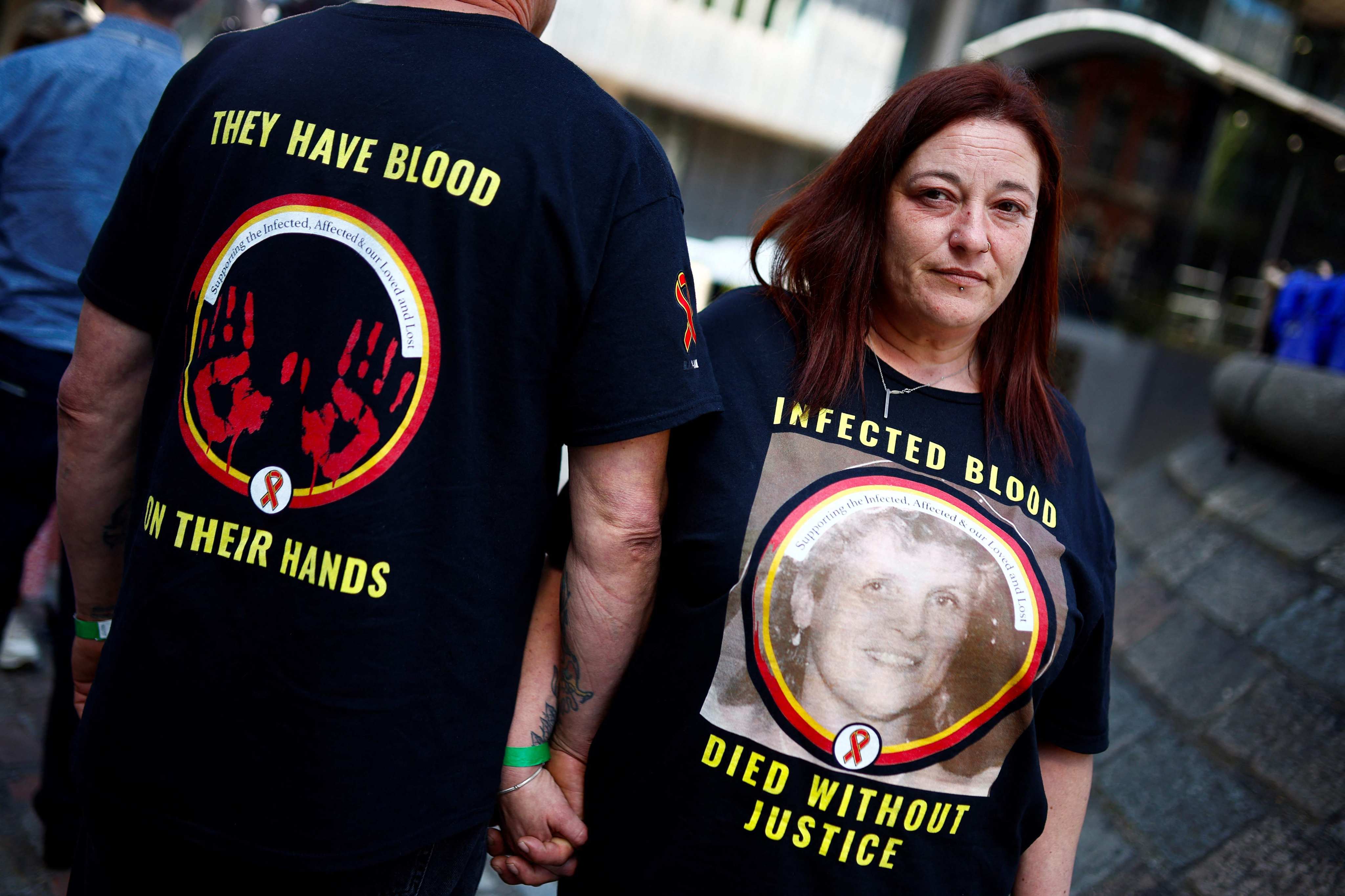 A relative of a victim wears a t-shirt reading “Infected blood, died without justice” as she stands outside Westminster, in central London, on May 20 during the release of the Infected Blood Inquiry final report. Photo: AFP