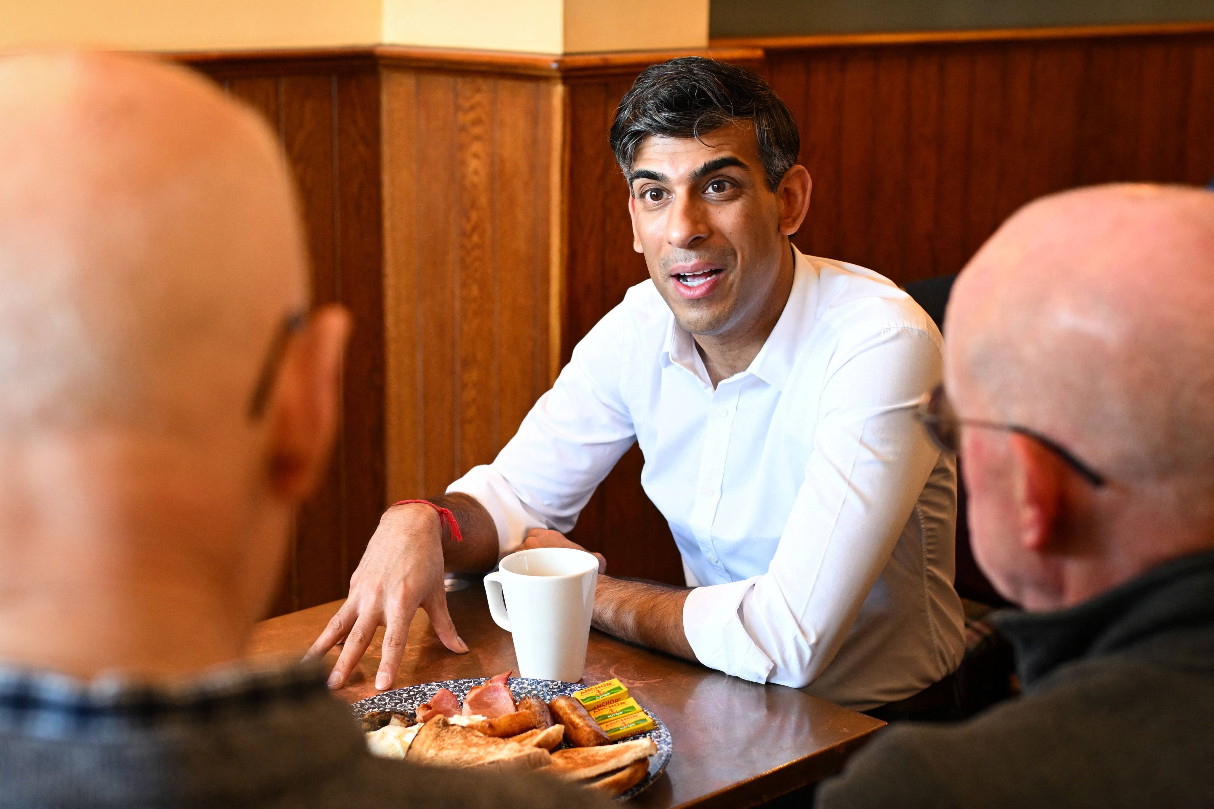 Britain’s Prime Minister Rishi Sunak meets veterans at a community breakfast in Northallerton, North Yorkshire, on Saturday. Photo: AFP