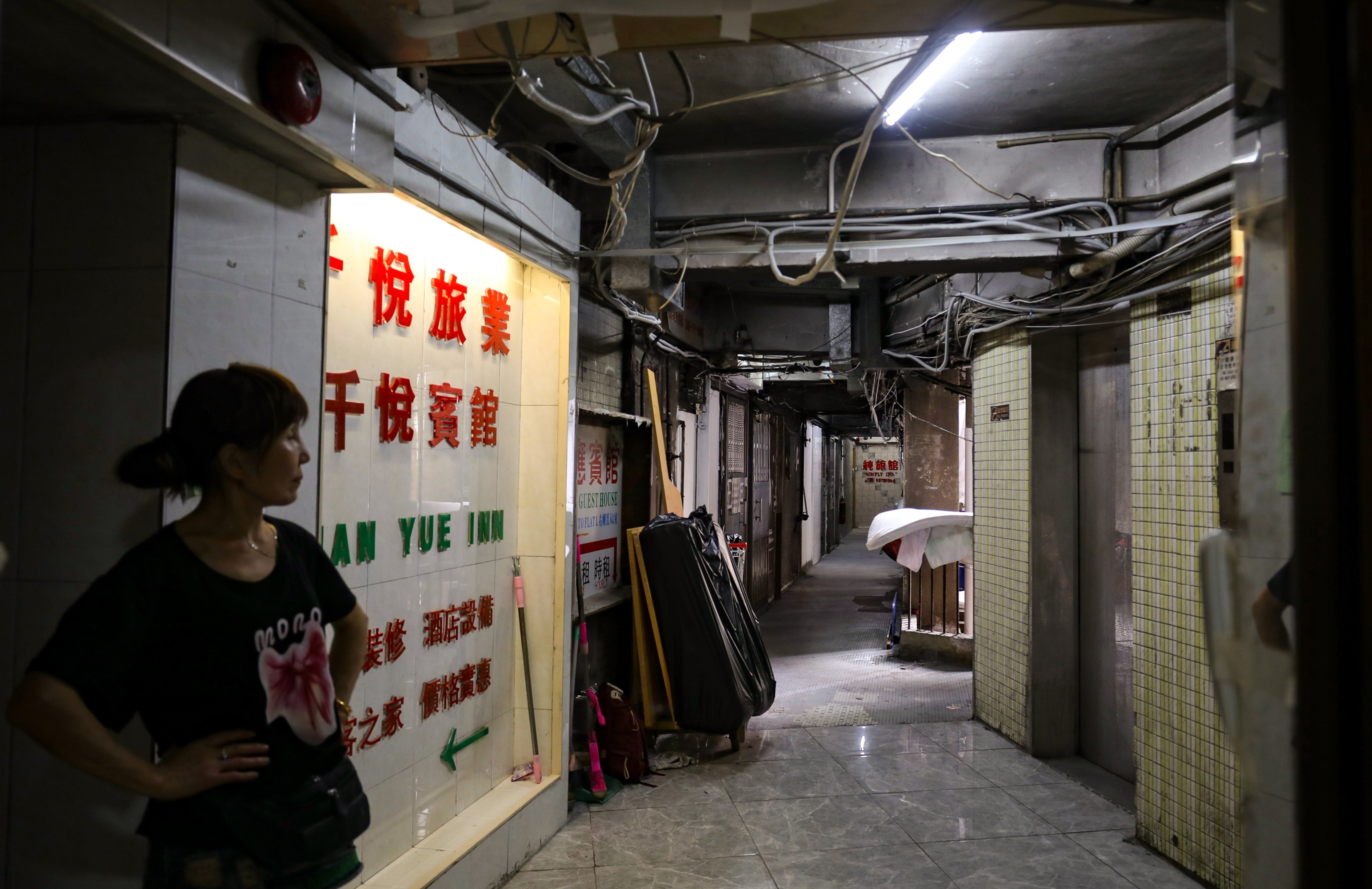 Some residents and businesses have returned to New Lucky House following the fatal fire. Photo: Xiaomei Chen
