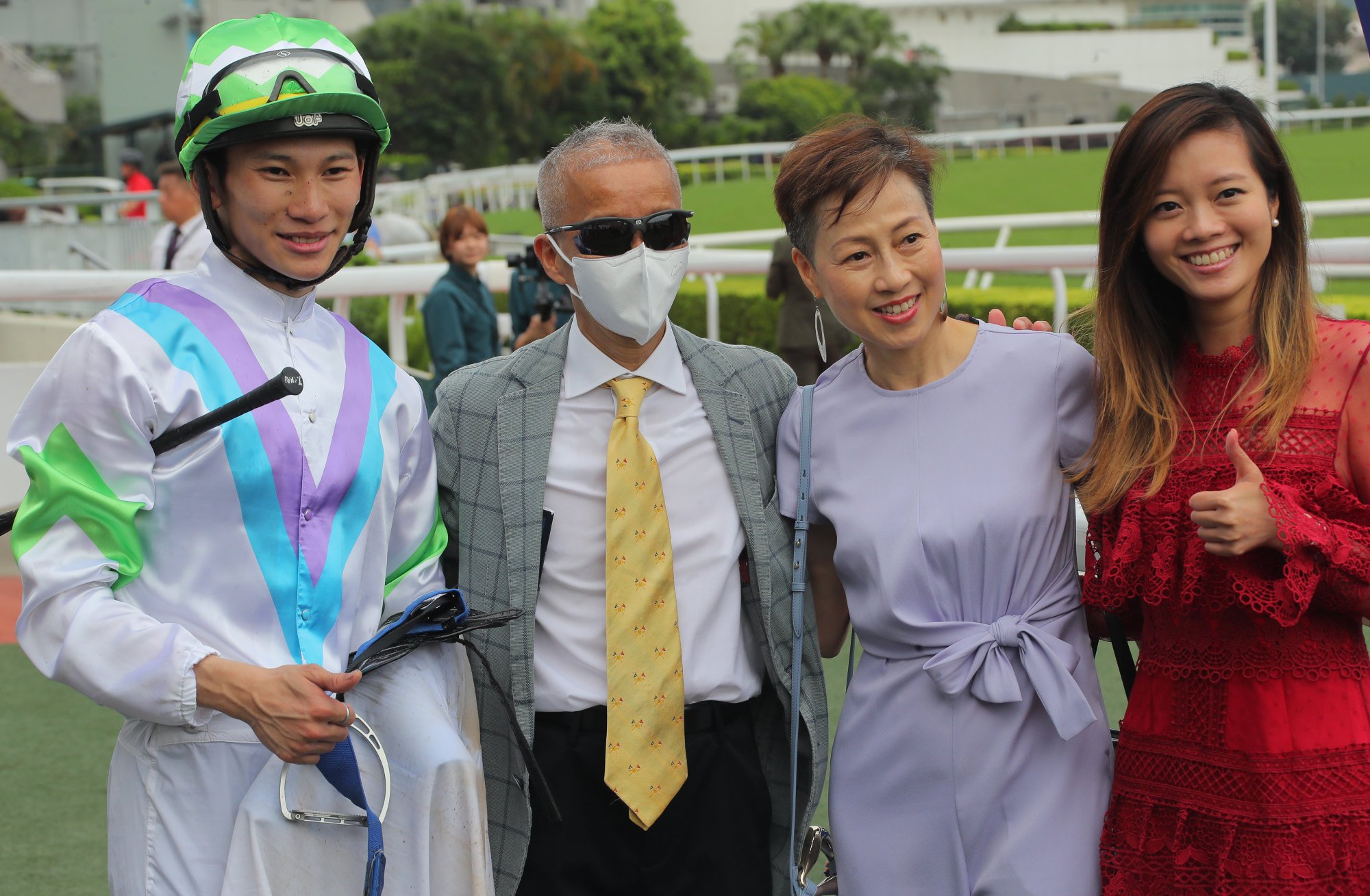 Jockey Jerry Chau, trainer Benno Yung and the handler’s family celebrate Top Peak’s win at Sha Tin.