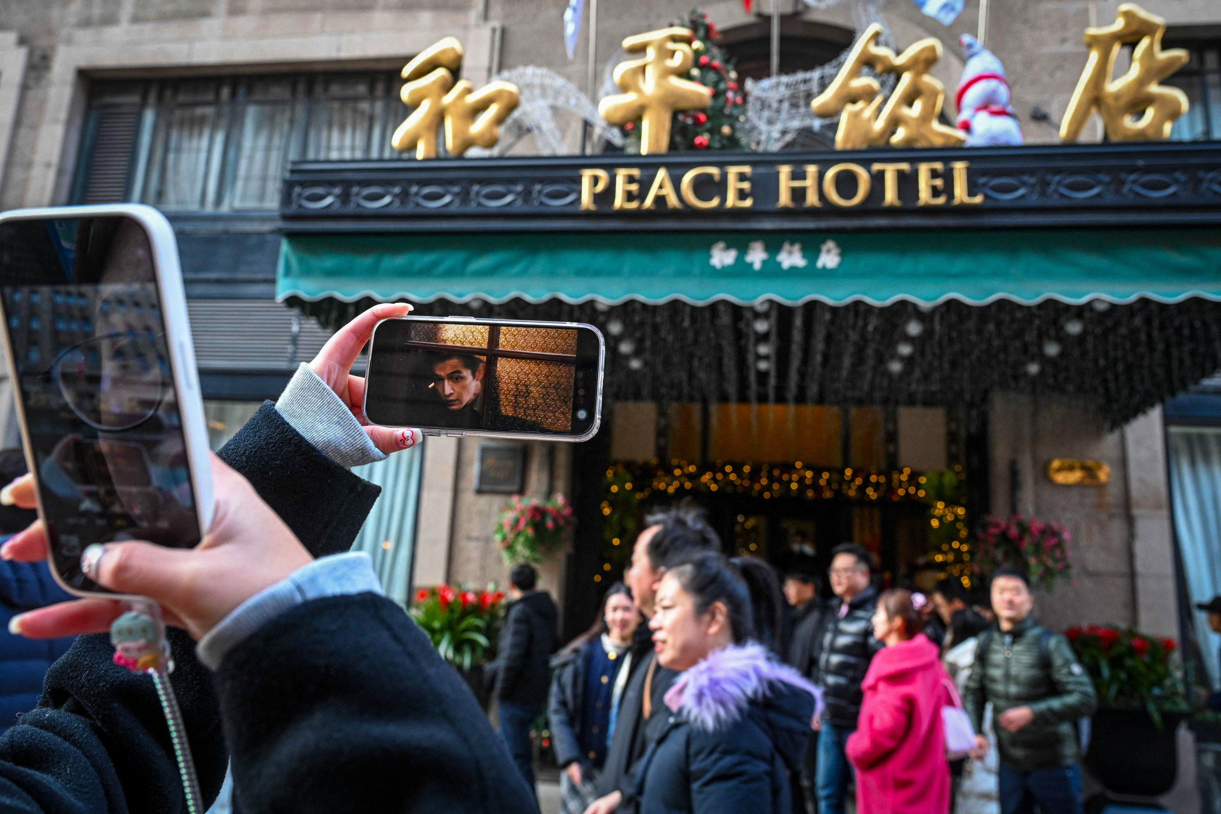 People visiting the historic Peace Hotel in Shanghai, the backdrop in a hit television drama in Hong Kong. Photo: AFP