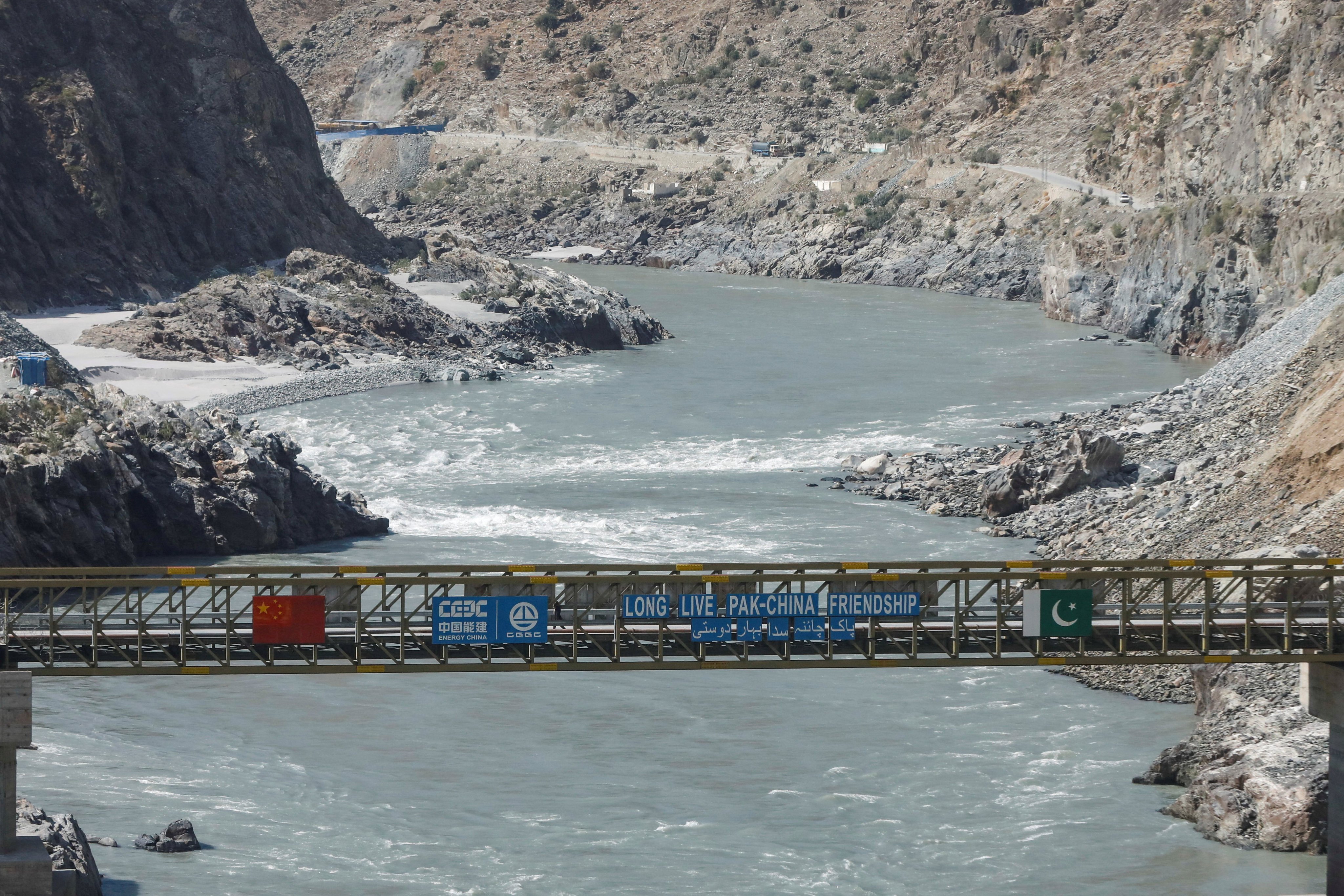 A bridge with the flags of China and Pakistan over the River Indus, at the site of Dasu Dam or Dasu Hydropower Project, in Kohistan district Kyber Pakhtunkhwa province, near Dasu, Pakistan. Photo: Reuters