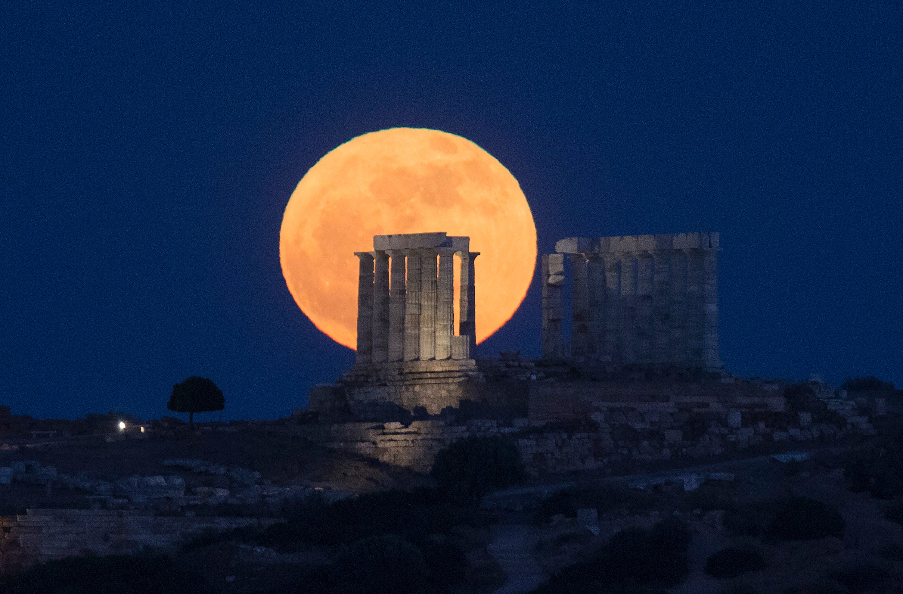 The moon is seen rising behind the Temple of Poseidon in Greece. Japan’s ispace Inc. aims to plant Unesco’s disc on  the moon later this year. Photo: Xinhua