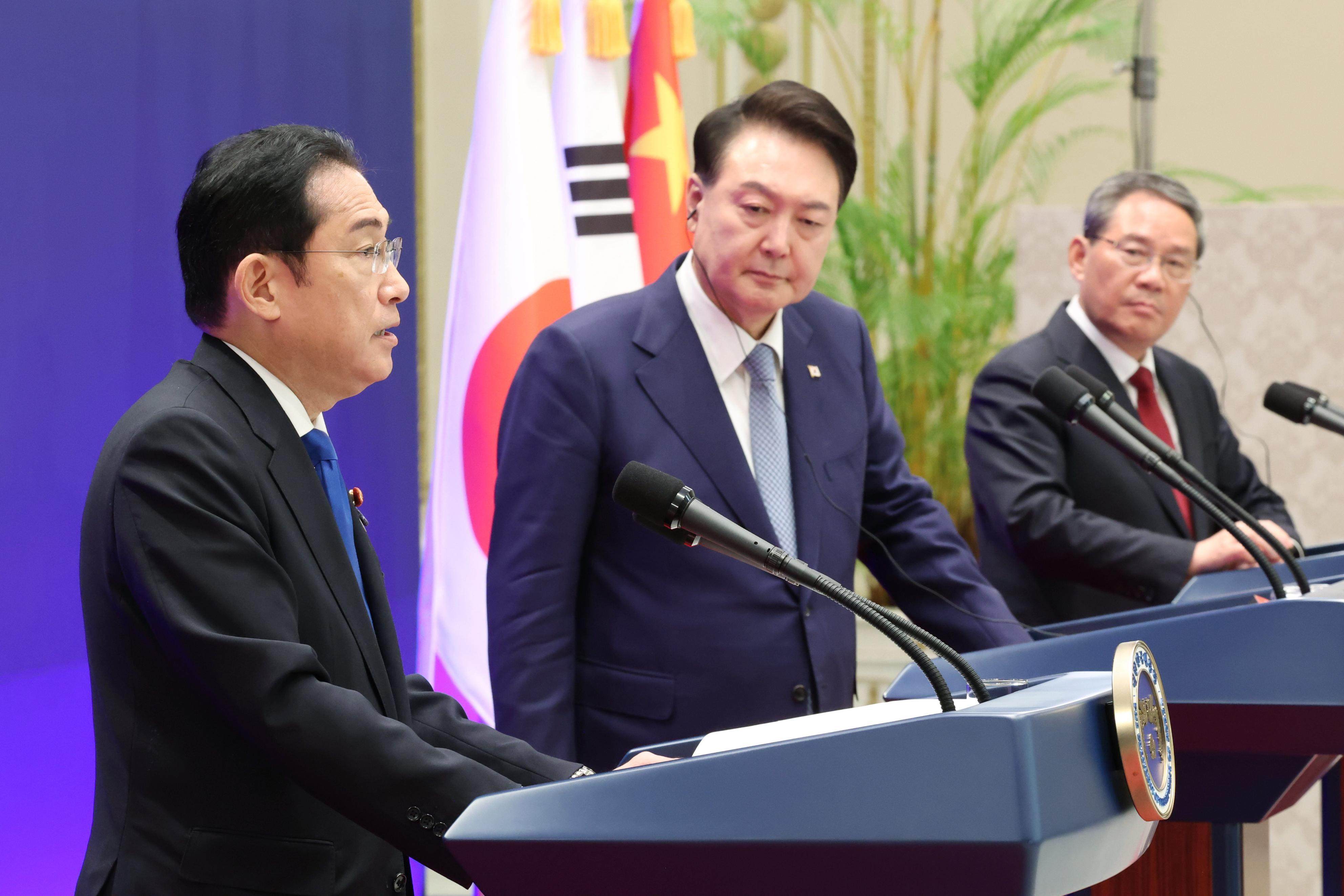 Japanese Prime Minister Fumio Kishida, South Korean President Yoon Suk Yeol and Chinese Premier Li Qiang held their first trilateral summit in more than four years in Seoul  Photo: Pool photo Kyodo