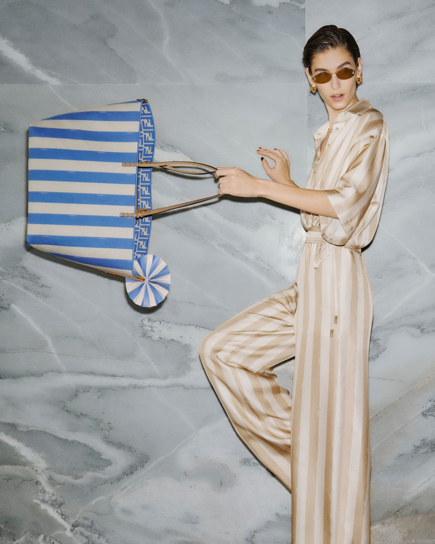 Fendi’s summer 2024 capsule collection is inspired by Rome in the summer and is long on stripes on outfits and luggage of all sizes. Photo: Handout