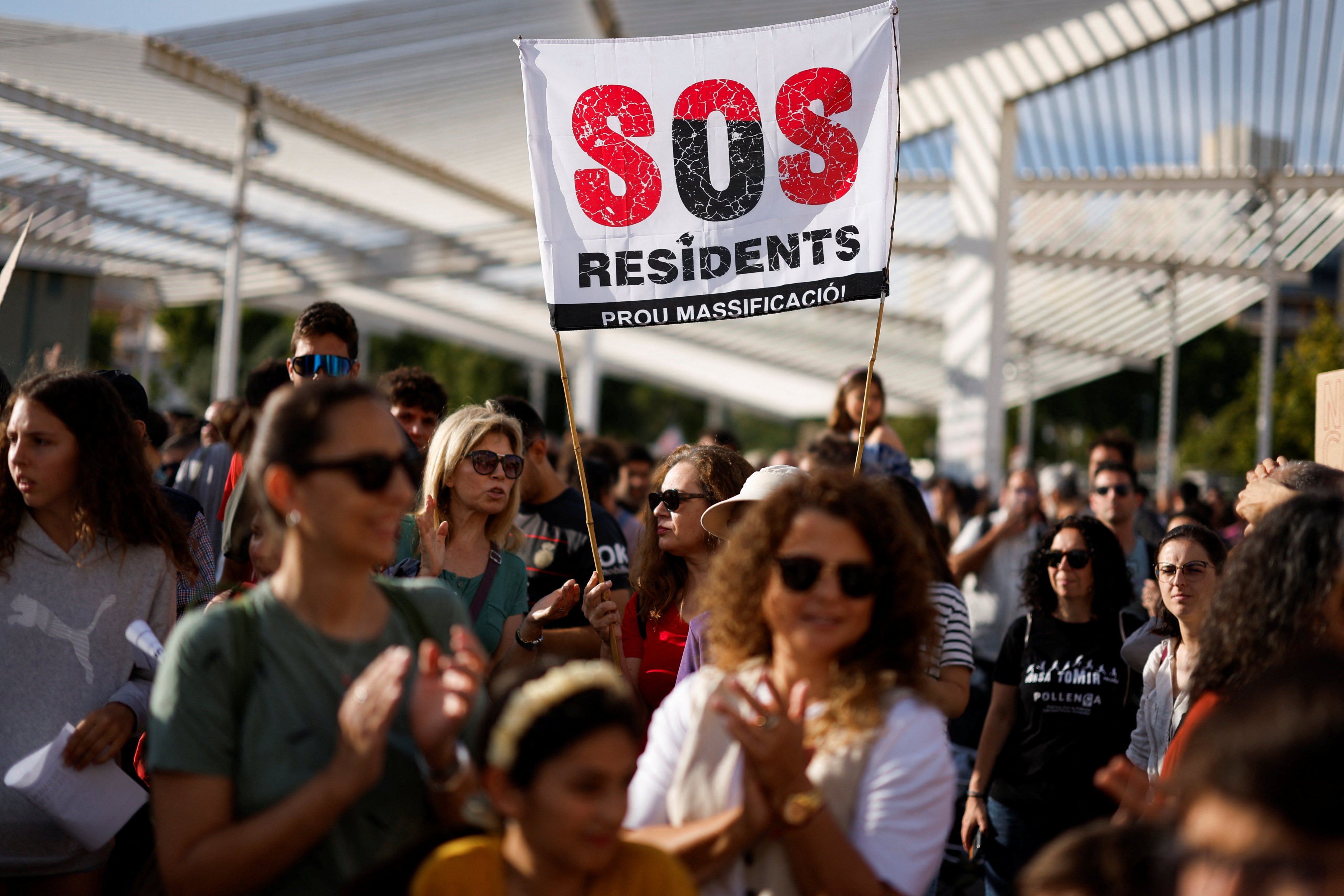 People in Palma de Mallorca, Spain, take part in a protest against mass tourism, which they say is responsible for increasing housing costs for locals. Photo: Reuters