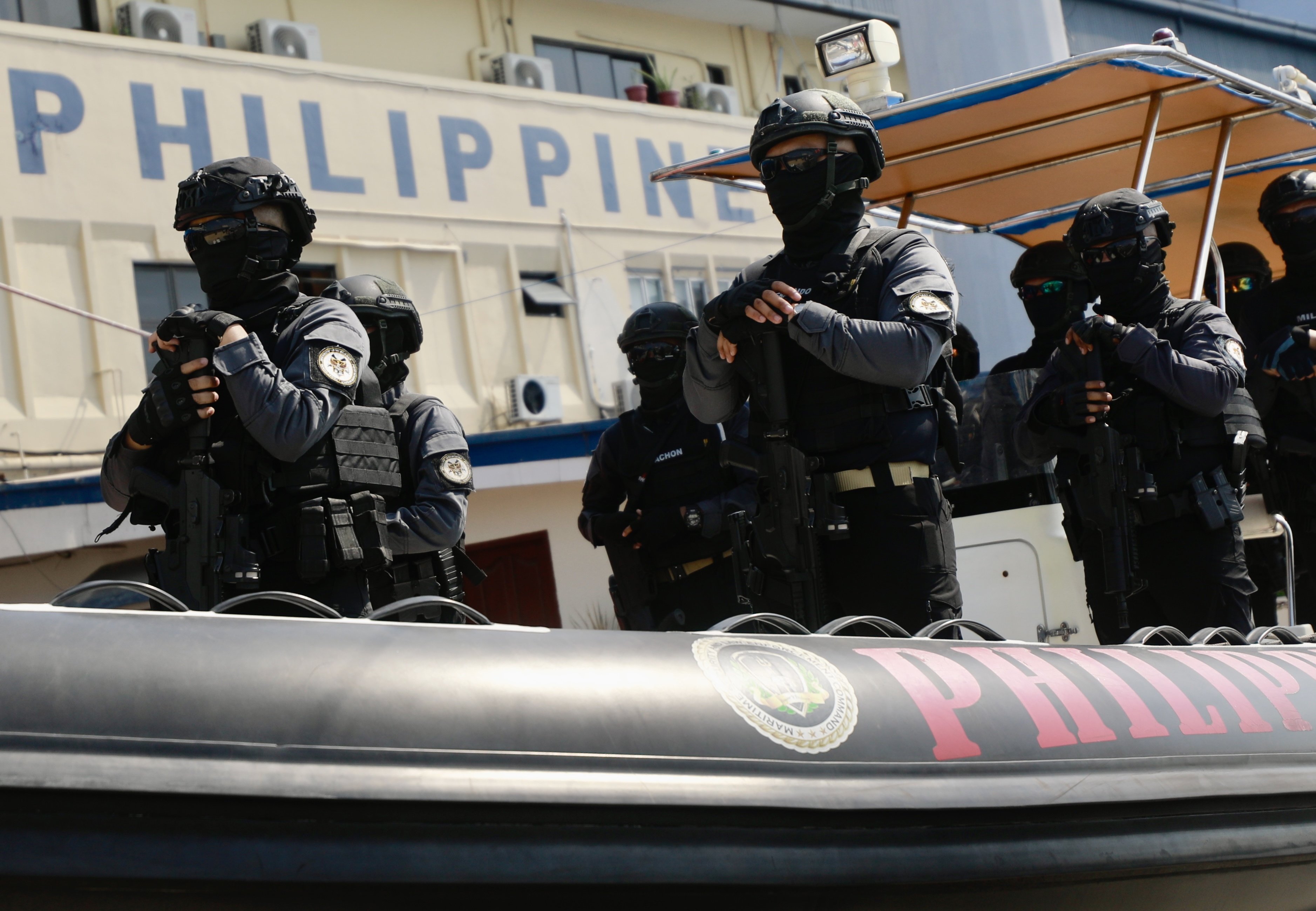 Philippine coastguard personnel on a rubber boat at a ceremony at a seaport in Manila. Photo: EPA-EFE