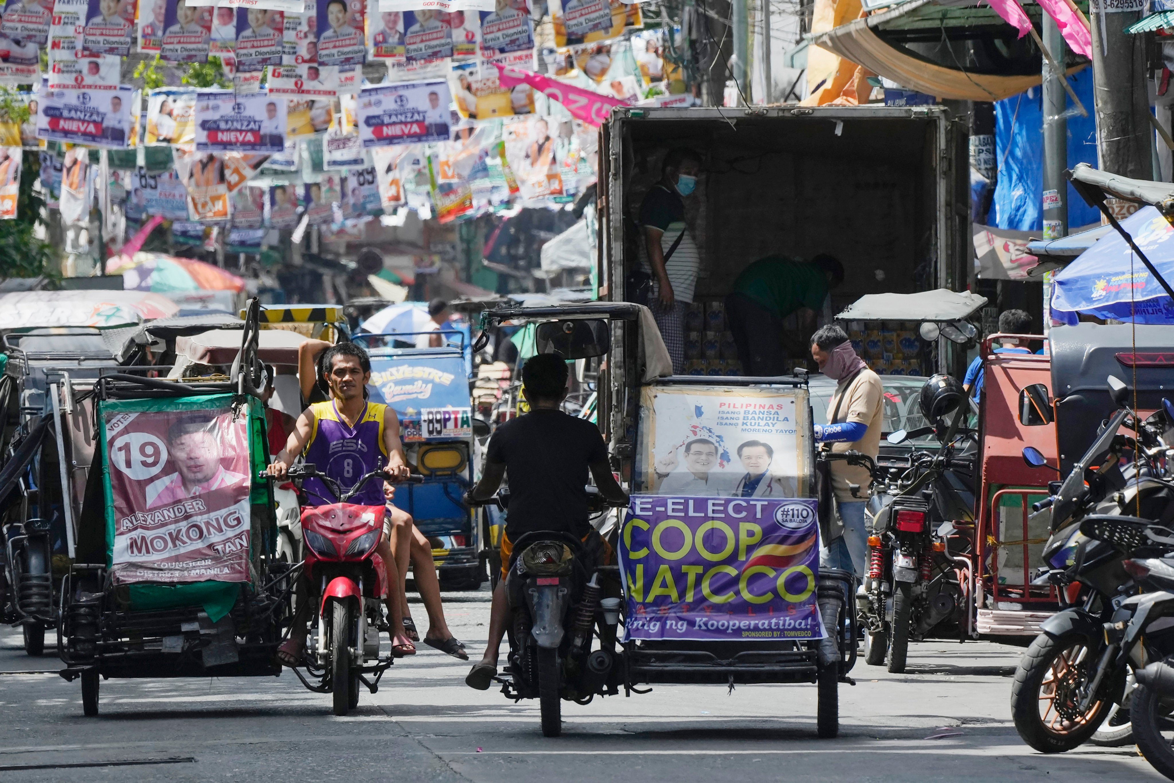 Pedicab drivers move on a street in Manila, Philippines. Economies in Asia and the Pacific need to do more to ensure workers get the education, training to raise incomes and ensure social equity, a UN report said on Tuesday. Photo: AP/File