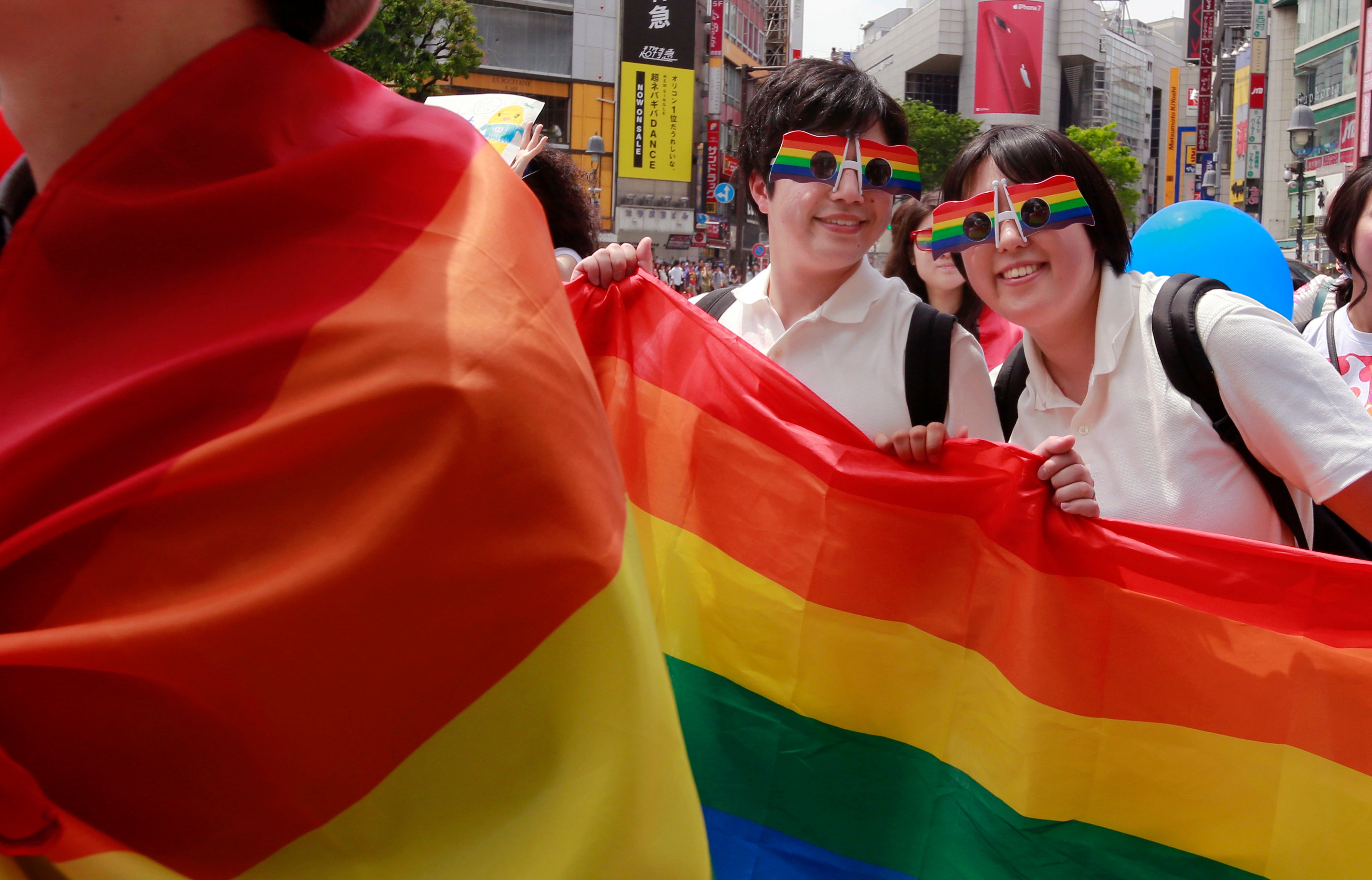 Participants march with a banner during the Tokyo Rainbow Pride parade in support of the LGBTQ community. Photo: AP