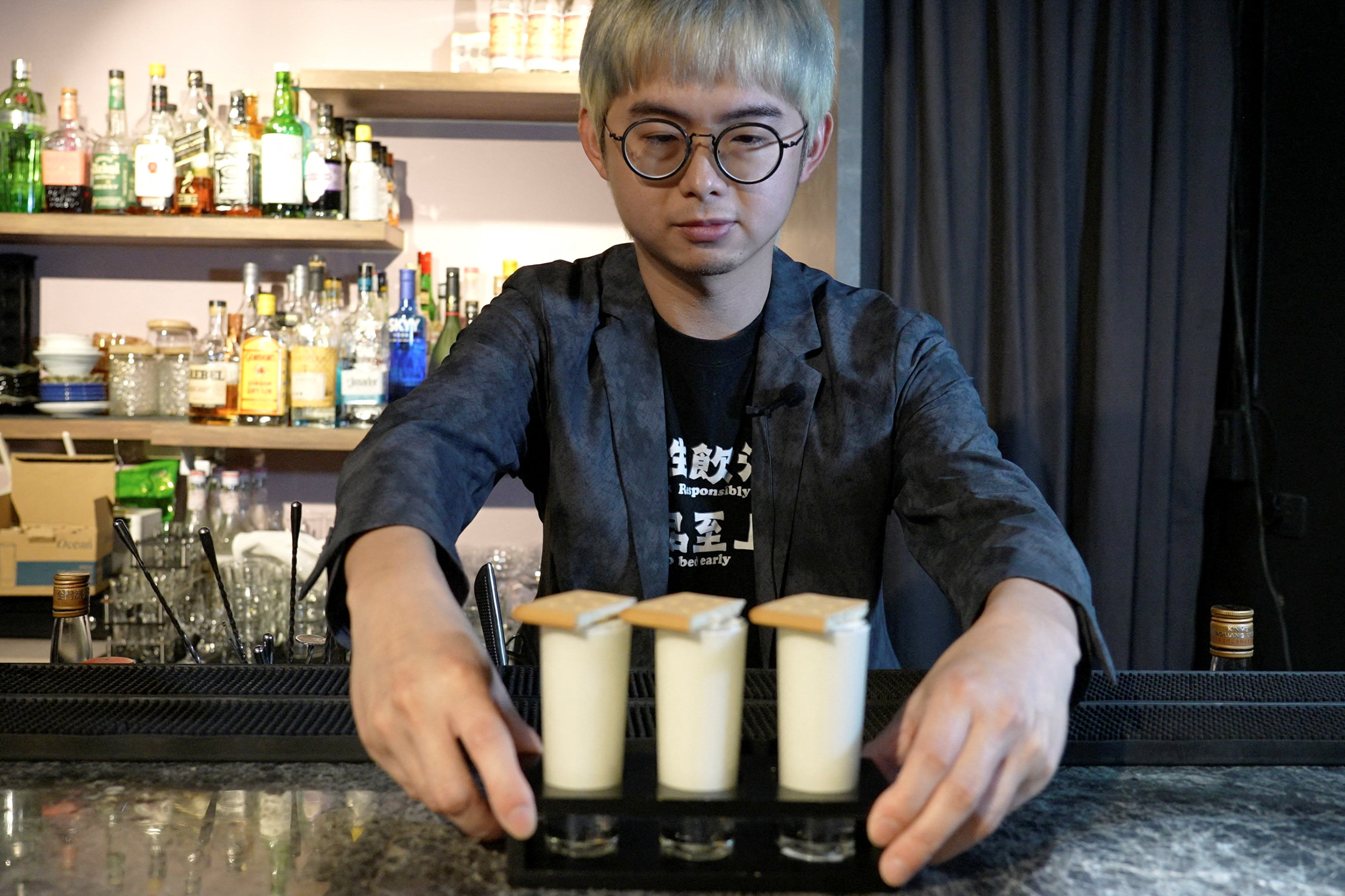 Powei Lee, 31, owner of Vent Bar, on Quemoy, Taiwan, with his Pick and Eat cocktails. His drinks celebrate local ingredients, and are named after historical events on the island near mainland China. Photo: Reuters 