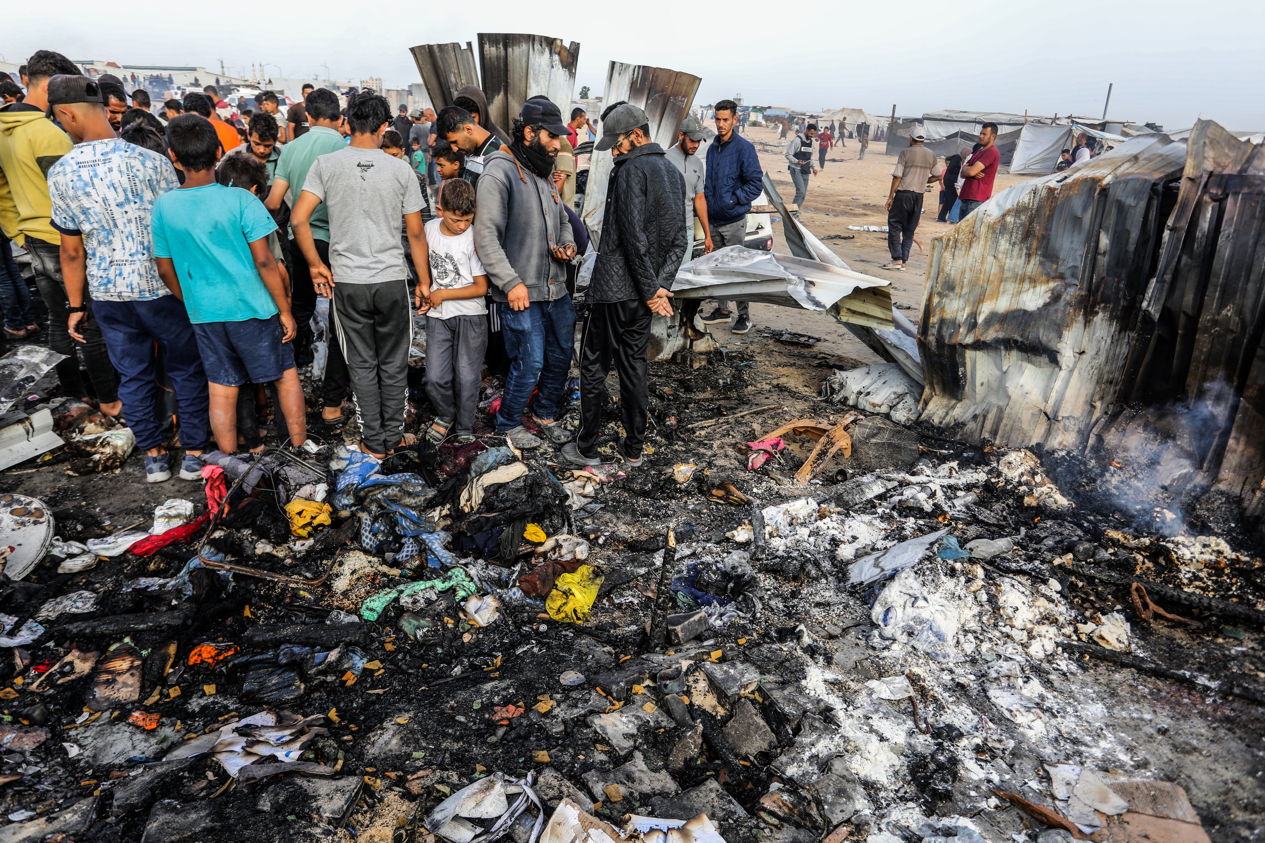 Palestinians inspect their destroyed tents after an Israeli air strike, which resulted in numerous deaths and  injuries, in the Al-Mawasi area. Photo: dpa