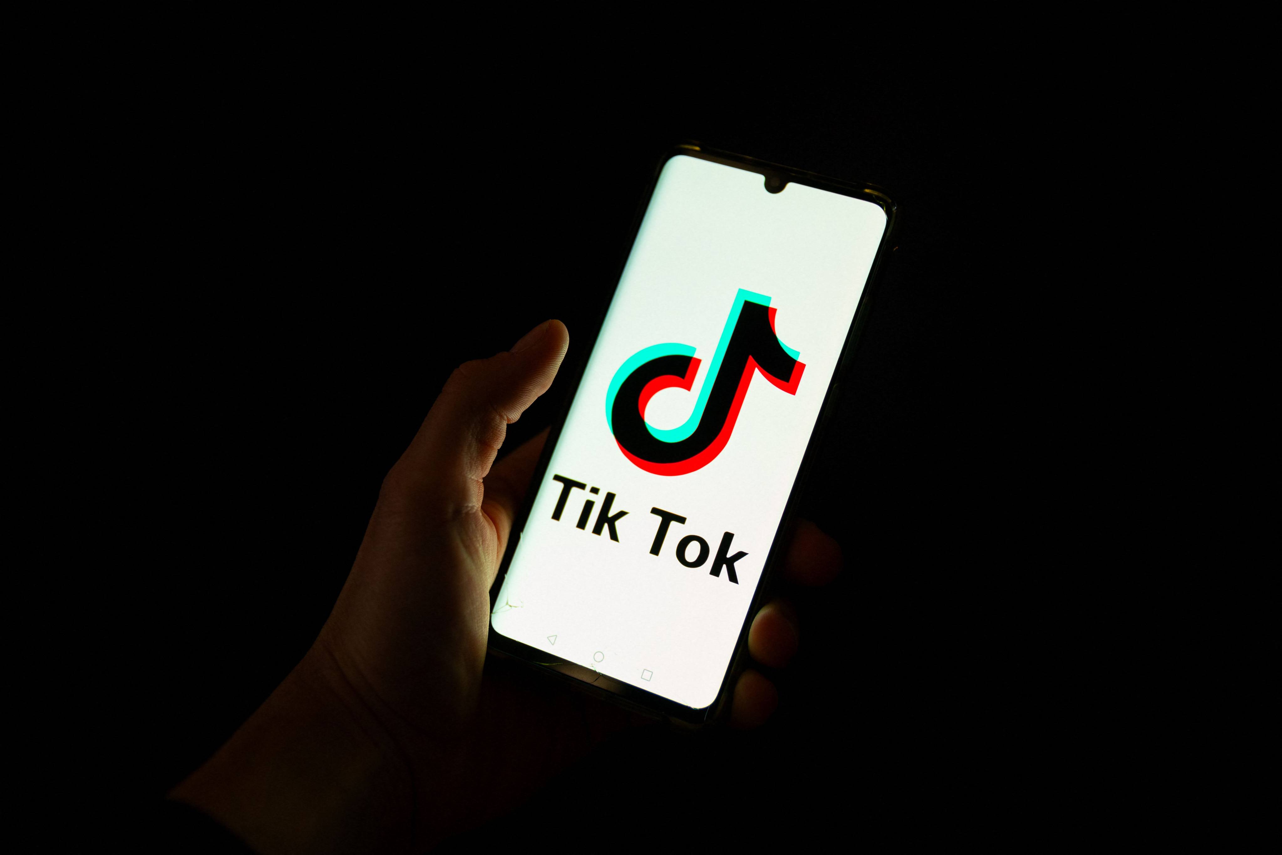 The TikTok app is seen on a phone. Philippine regulators say outlawing the app would be a last resort. Photo: AFP