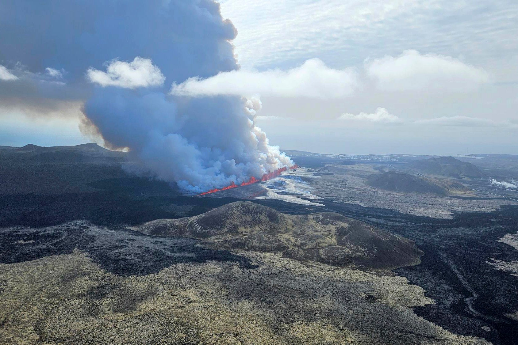 A volcano in southwestern Iceland is erupting, spewing red streams of lava in its latest display of nature’s power. Photo: Iceland Civil Defense via AP