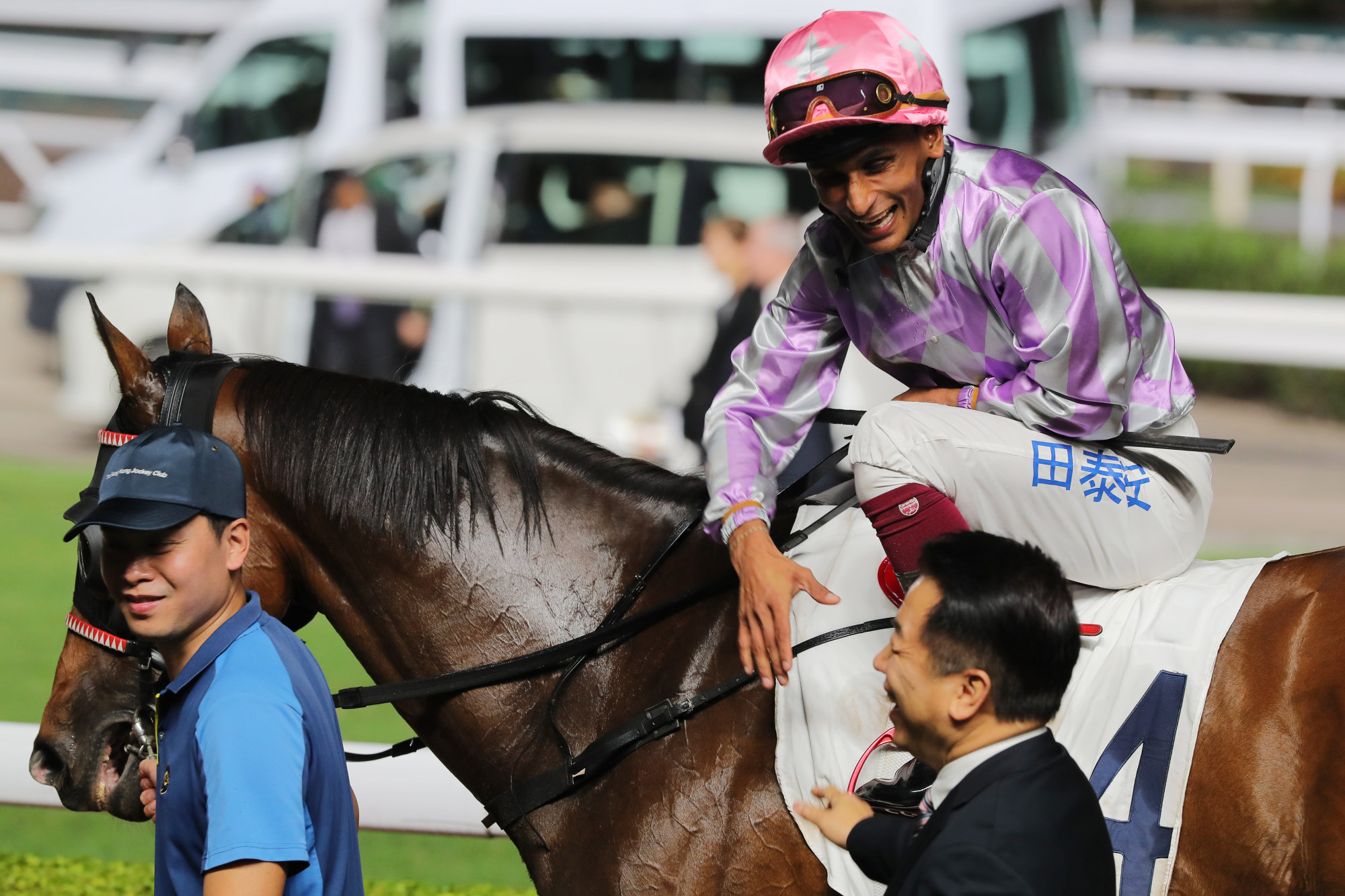 Jockey Karis Teetan goes to shake trainer Ricky Yiu’s hand after Adefill’s victory at Sha Tin on Wednesday night.