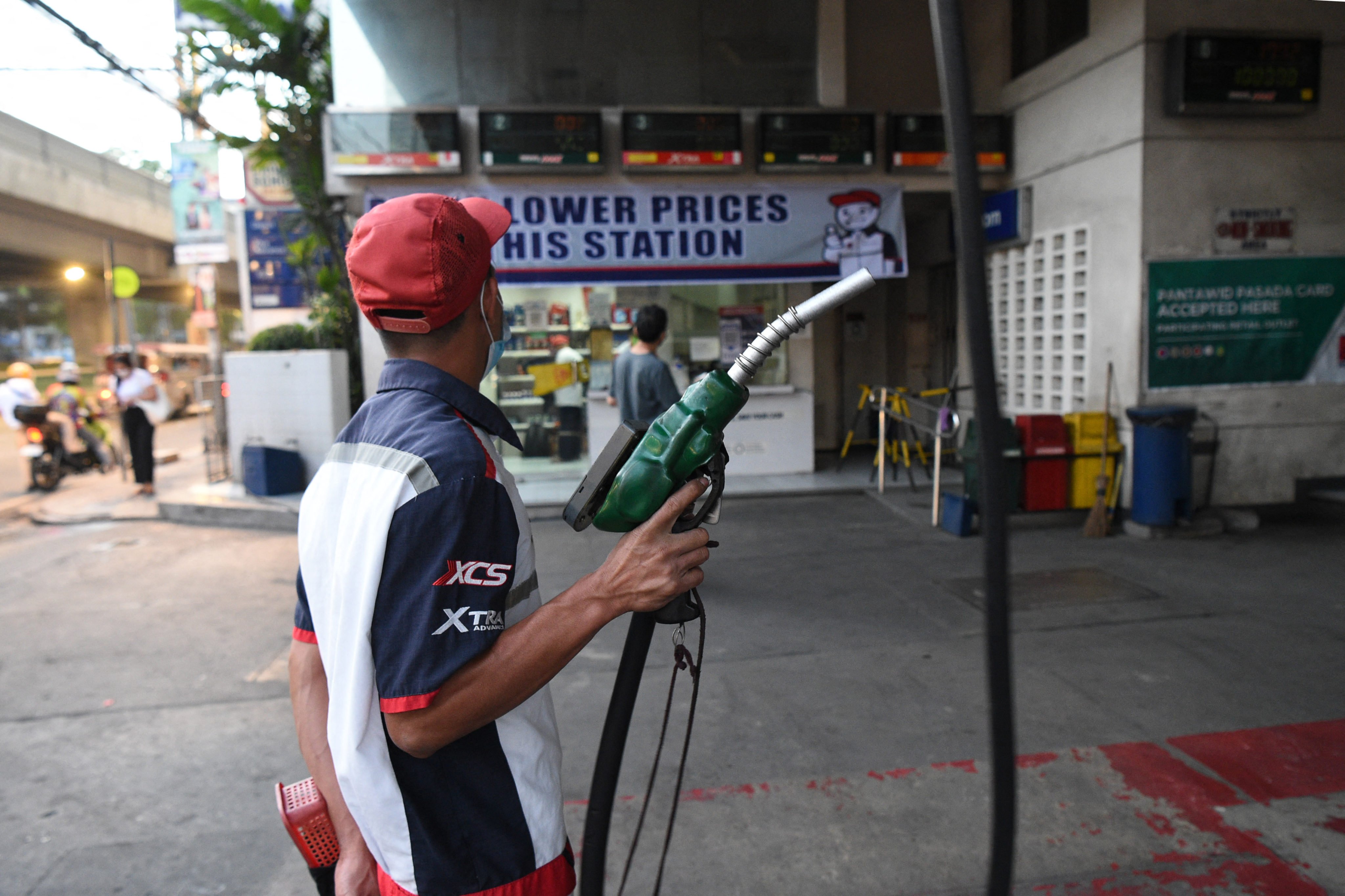 An attendant prepares to fill a customer’s vehicle with fuel at a petrol station in Manila. Proponents argue that the Philippines could subsidise fuel prices if it developed its own South China Sea energy reserves. Photo: AFP