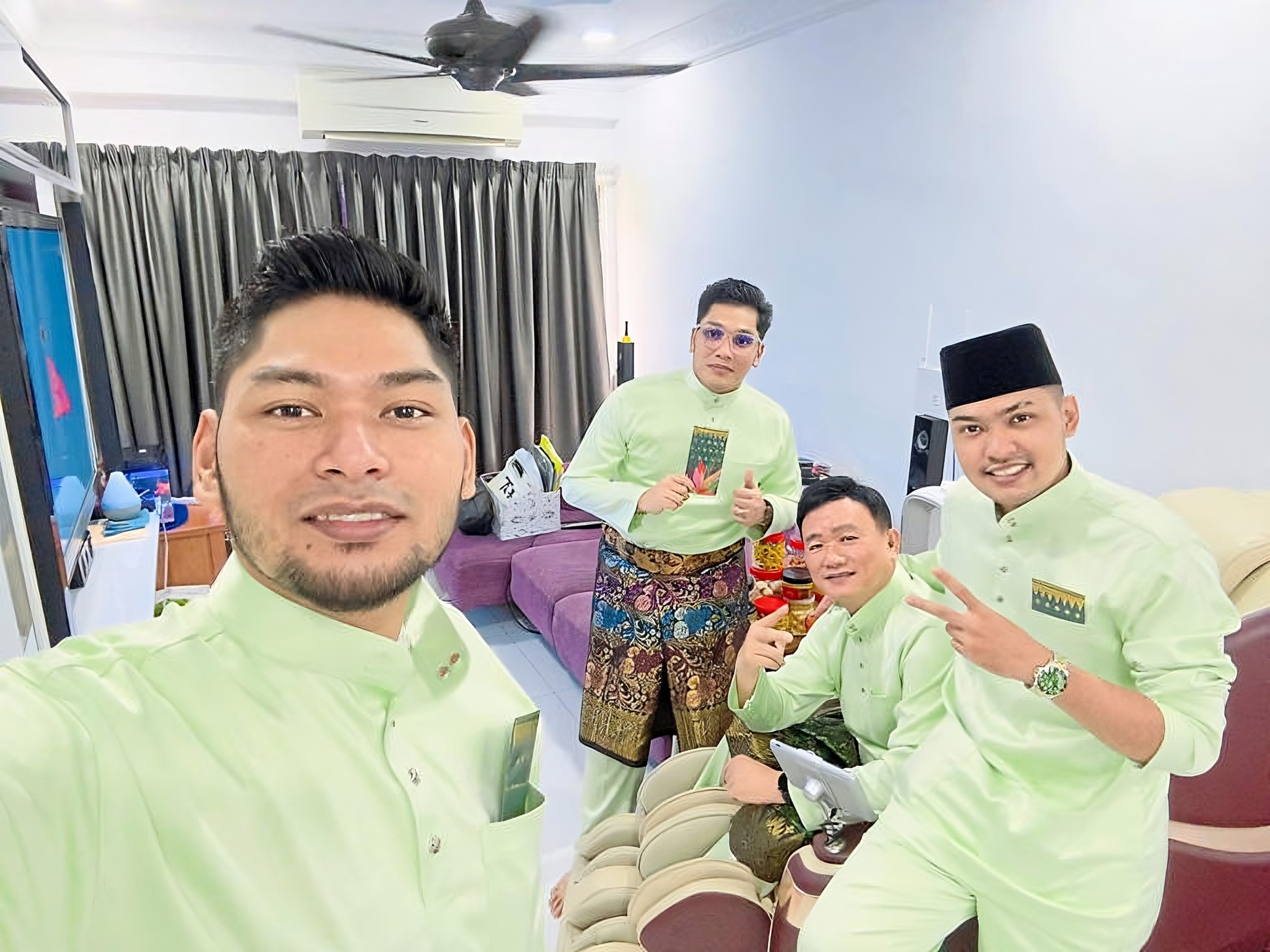 Michael Tong Wai Siong (second from right) with his adopted Malay sons (from left) Rasyid, Rafie and Abdul Rahman. Photo: Instagram/thestaronline