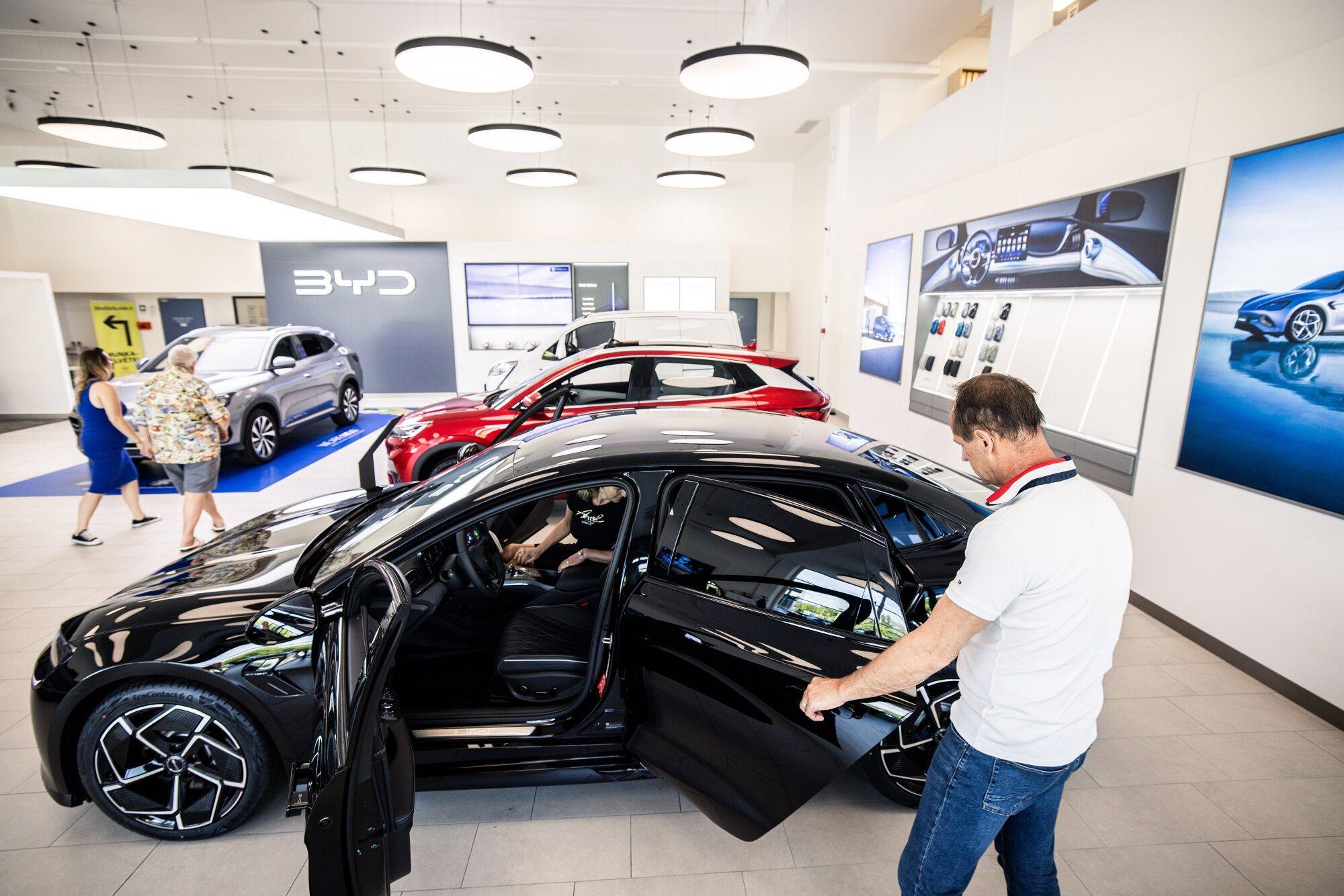 Customers look at electric vehicles inside a BYD showroom in Budapest, Hungary. Photo: Bloomberg
