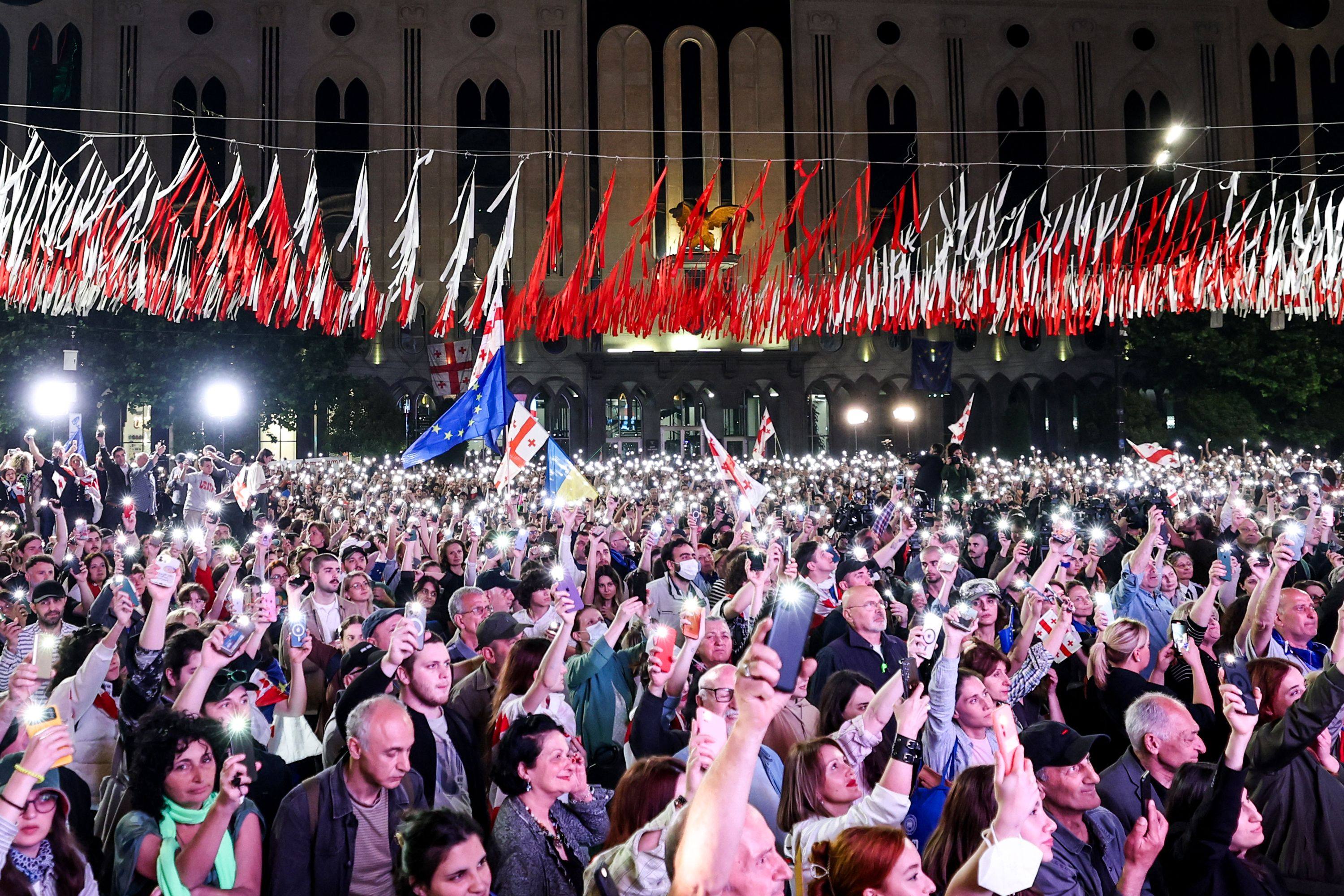 People protest outside the parliament building in central Tbilisi, Georgia. Photo: AFP