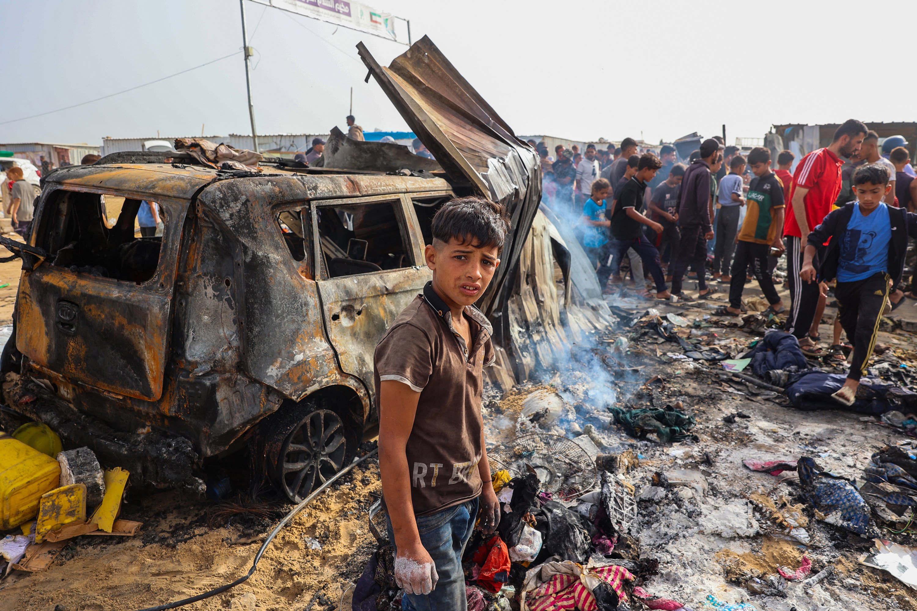 Palestinians gather at the site of an Israeli strike on a camp area housing internally displaced people in Rafah amid ongoing battles between Israel and the Palestinian Hamas militant group. Photo: TNS
