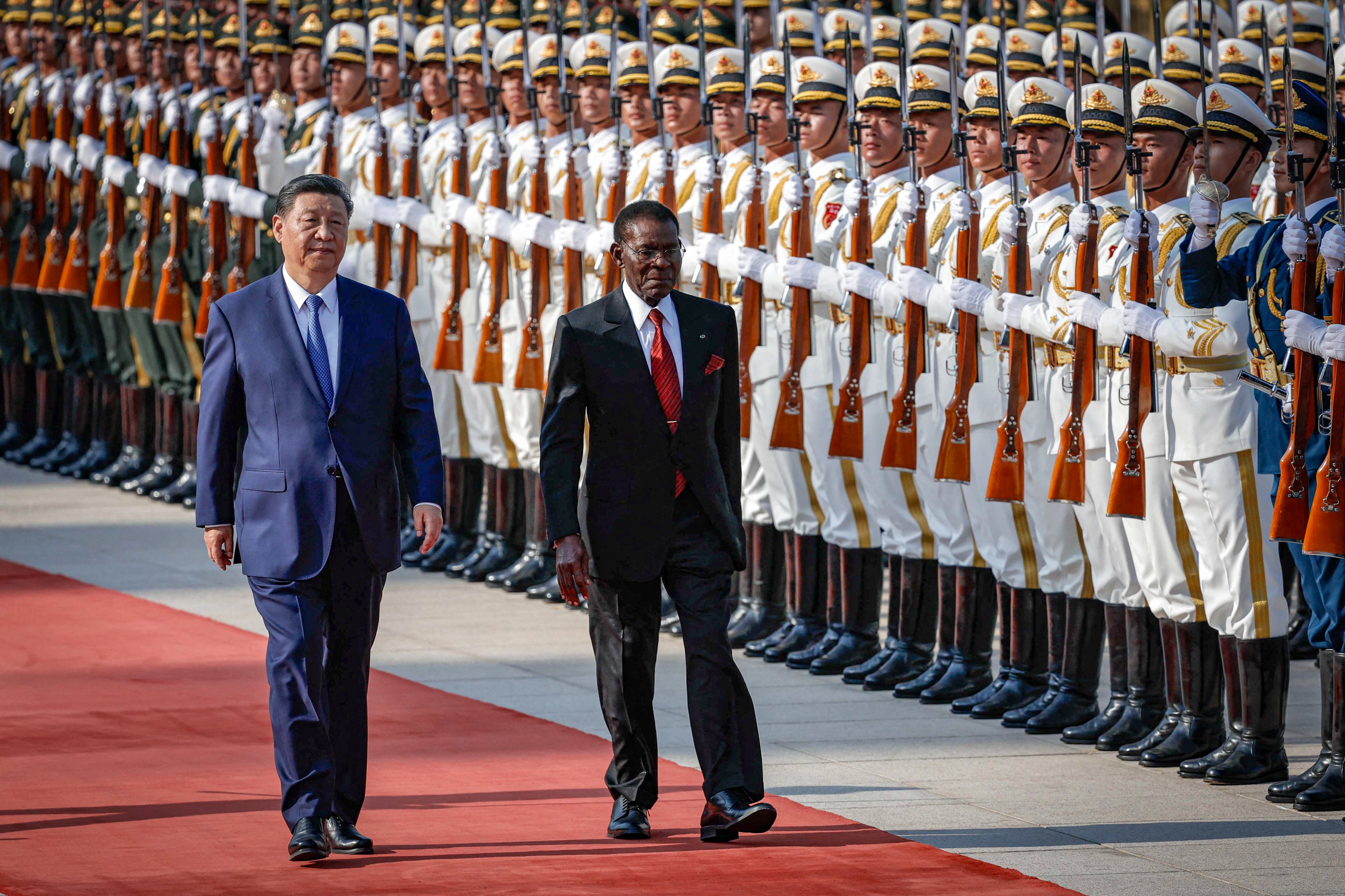Chinese President Xi Jinping  and President of Equatorial Guinea Teodoro Obiang Nguema Mbasogo attend a welcome ceremony at the Great Hall of the People in Beijing on Tuesday. Photo: AFP